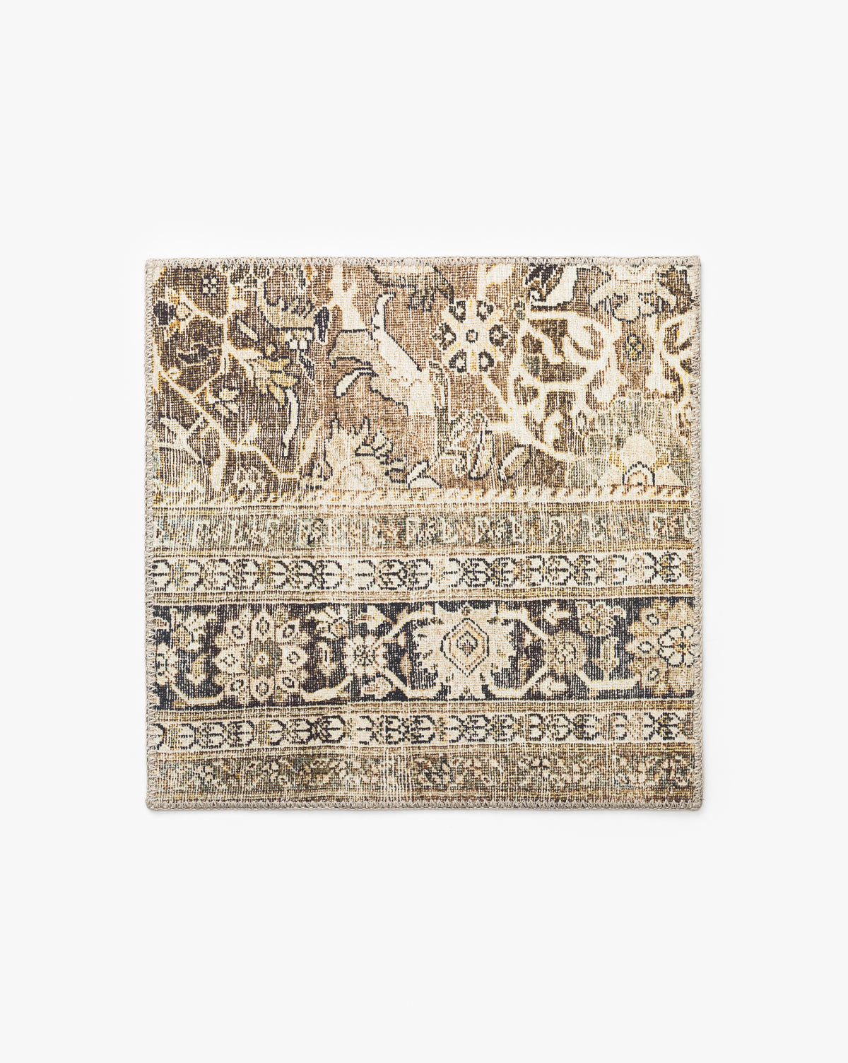 An Isameta Rug Swatch with a vintage-inspired floral and geometric pattern in beige, brown, and gray is shown on a plain white background by McGee & Co.