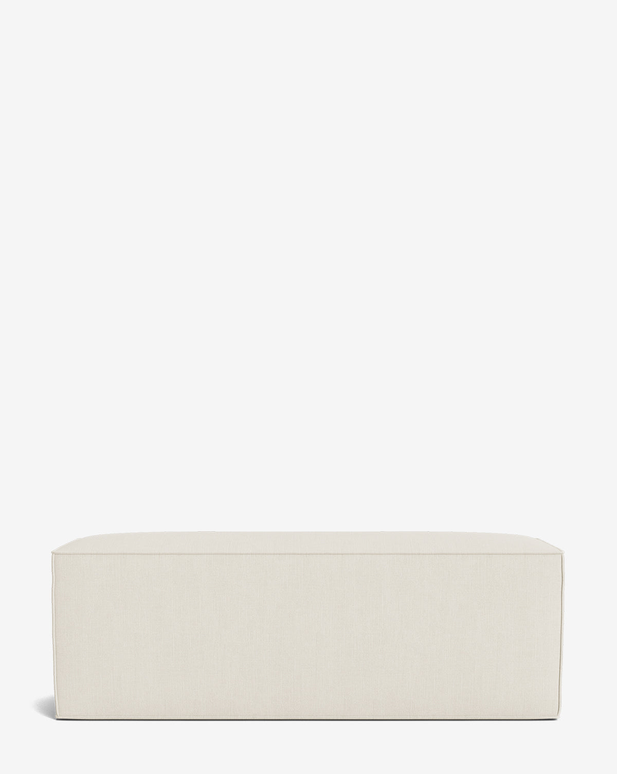 The Johannes Bench is a modern rectangular bench in light beige, featuring clean lines and hidden legs, shown against a plain white background by McGee & Co.