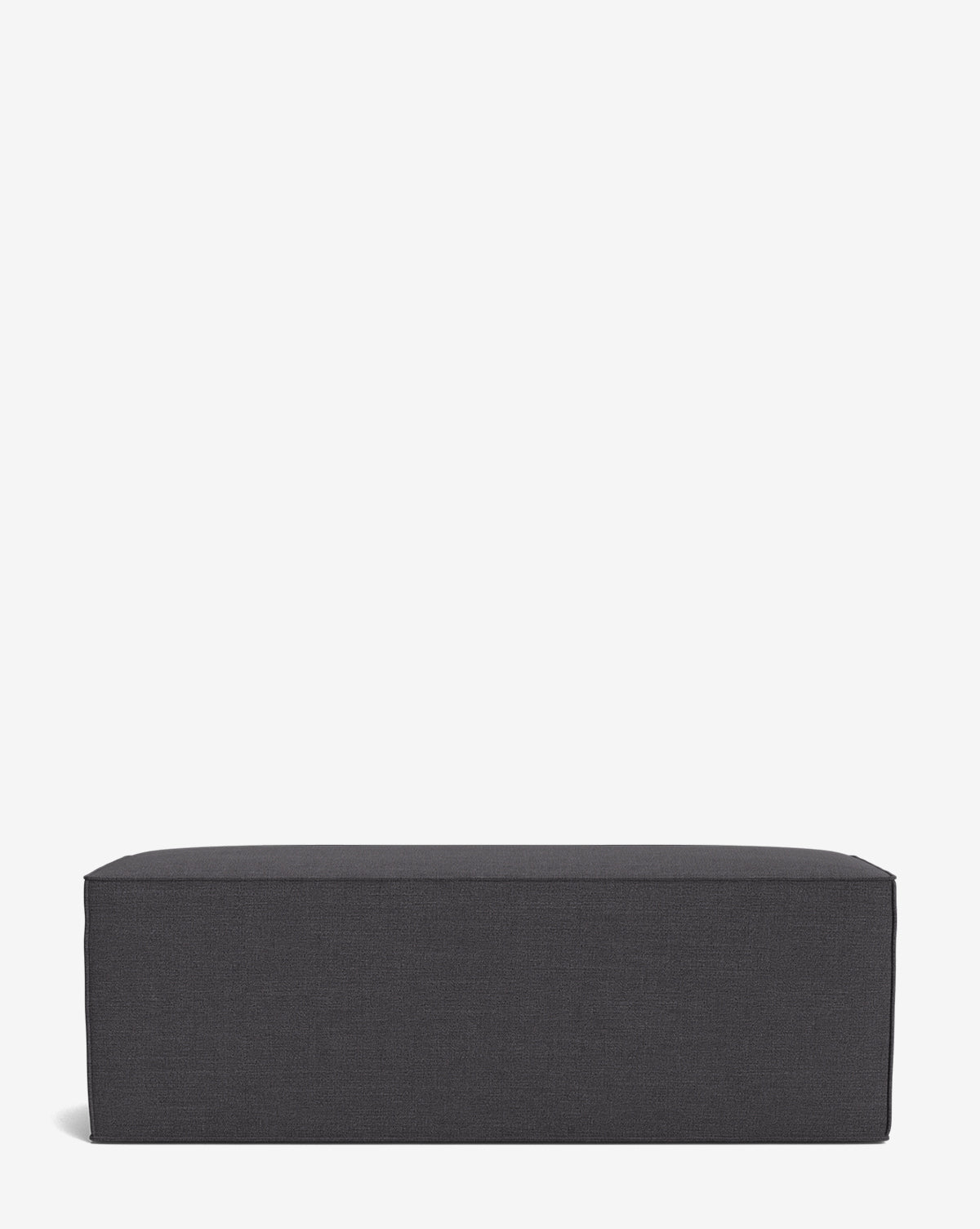 The Johannes Bench is a rectangular, dark gray cushioned bench with a minimalist design, shown against a plain white background by McGee & Co.