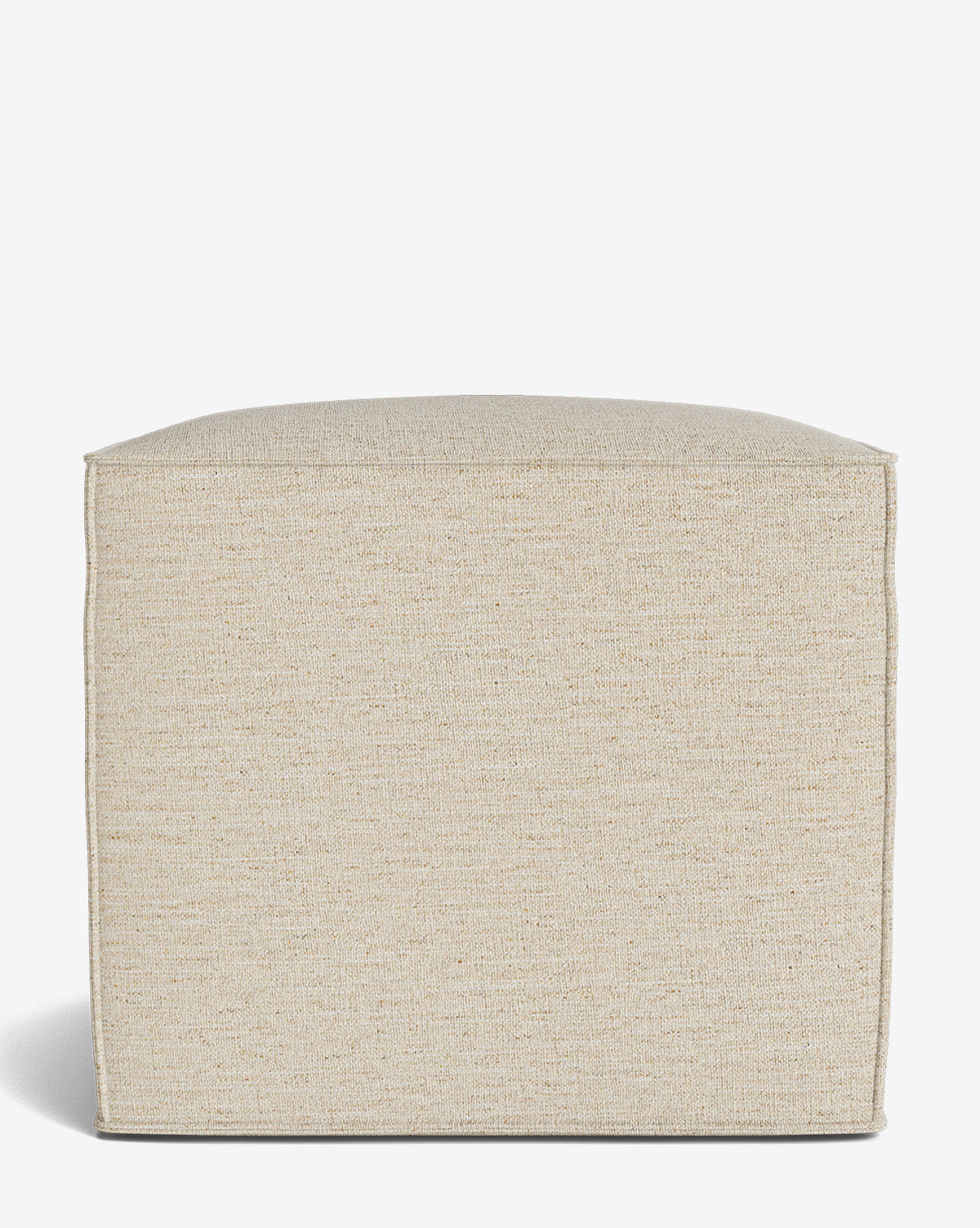 The Johannes Cube is a beige, square fabric ottoman with a cushioned seat and minimalist design, shown against a white background. This made-to-order piece adds understated elegance to any space, by McGee & Co.