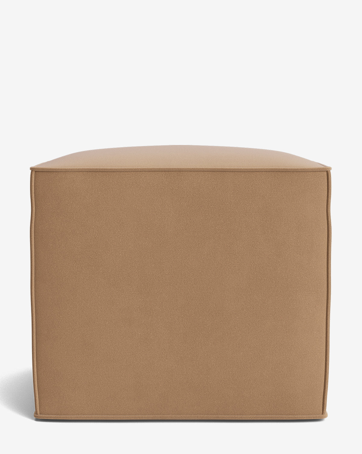 The Johannes Cube is a square ottoman with a cushioned seat, tan smooth fabric, and visible seam lines at the edges, shown on a plain white background by McGee & Co.