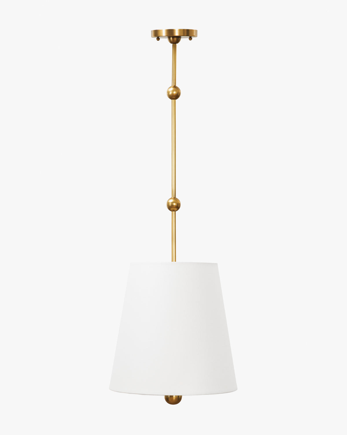 The Kipling Pendant showcases a gold metal rod with decorative spheres, an elegant white linen shade, and a coordinating gold ceiling mount, adding modern charm to any space, by McGee & Co.