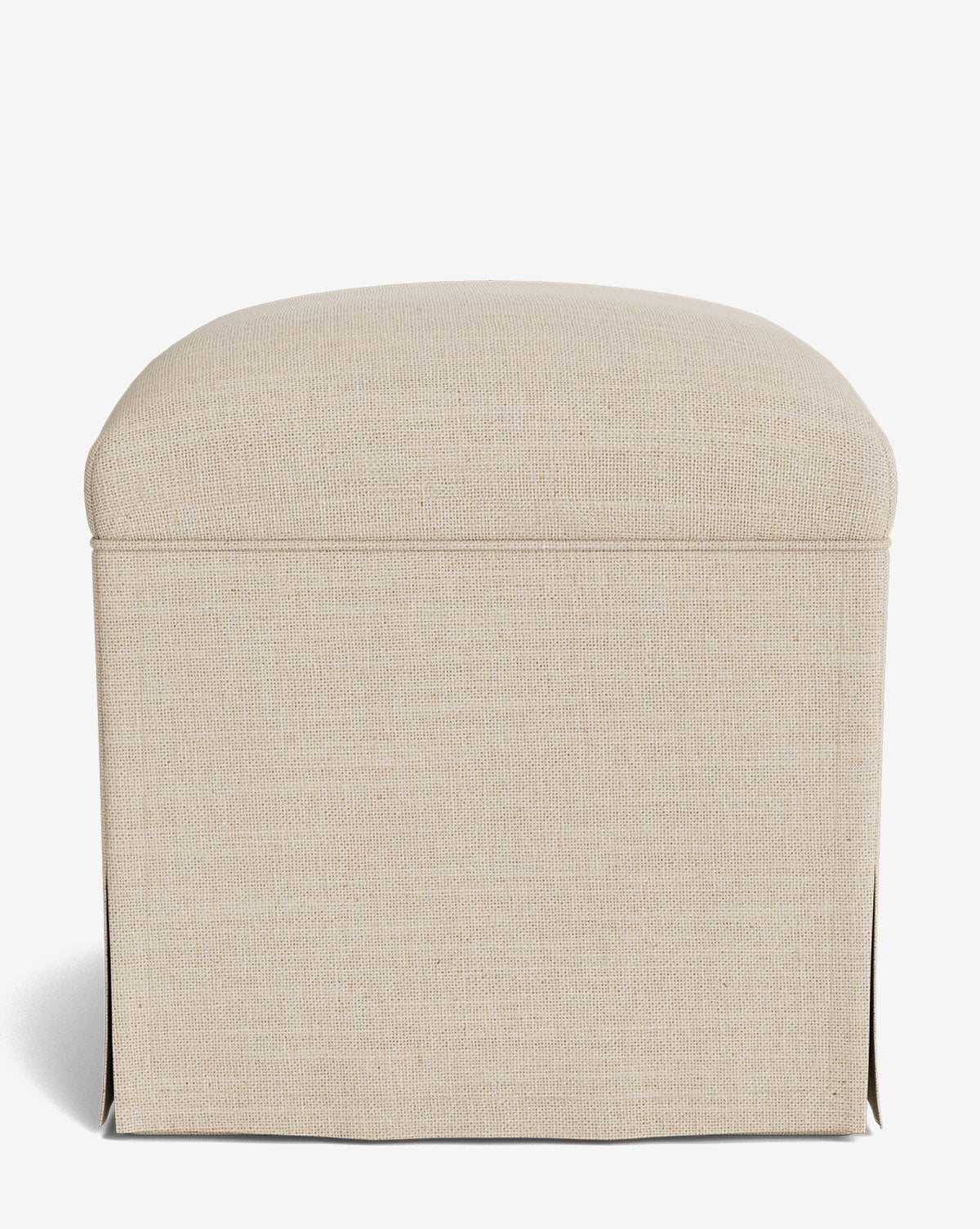 The Makerspalm Latimer Ottoman is a beige, square piece with a rounded padded top and elegant slip skirt base, displayed on a plain white background by McGee & Co.