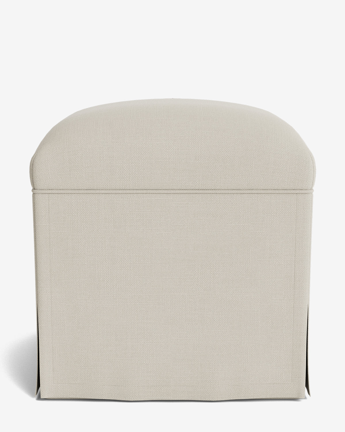 The Makerspalm Latimer Ottoman showcases beige upholstery in high-quality fabric, with a rounded top and tailored skirt, displayed against a plain white background by McGee & Co.