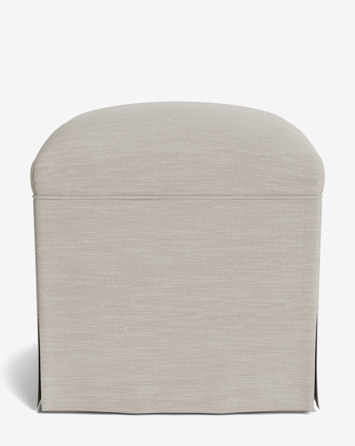 A Makerspalm Latimer Ottoman in beige, featuring high-quality fabric upholstery, a rounded top, and a skirted base, is displayed from the front against a plain white background by McGee & Co.