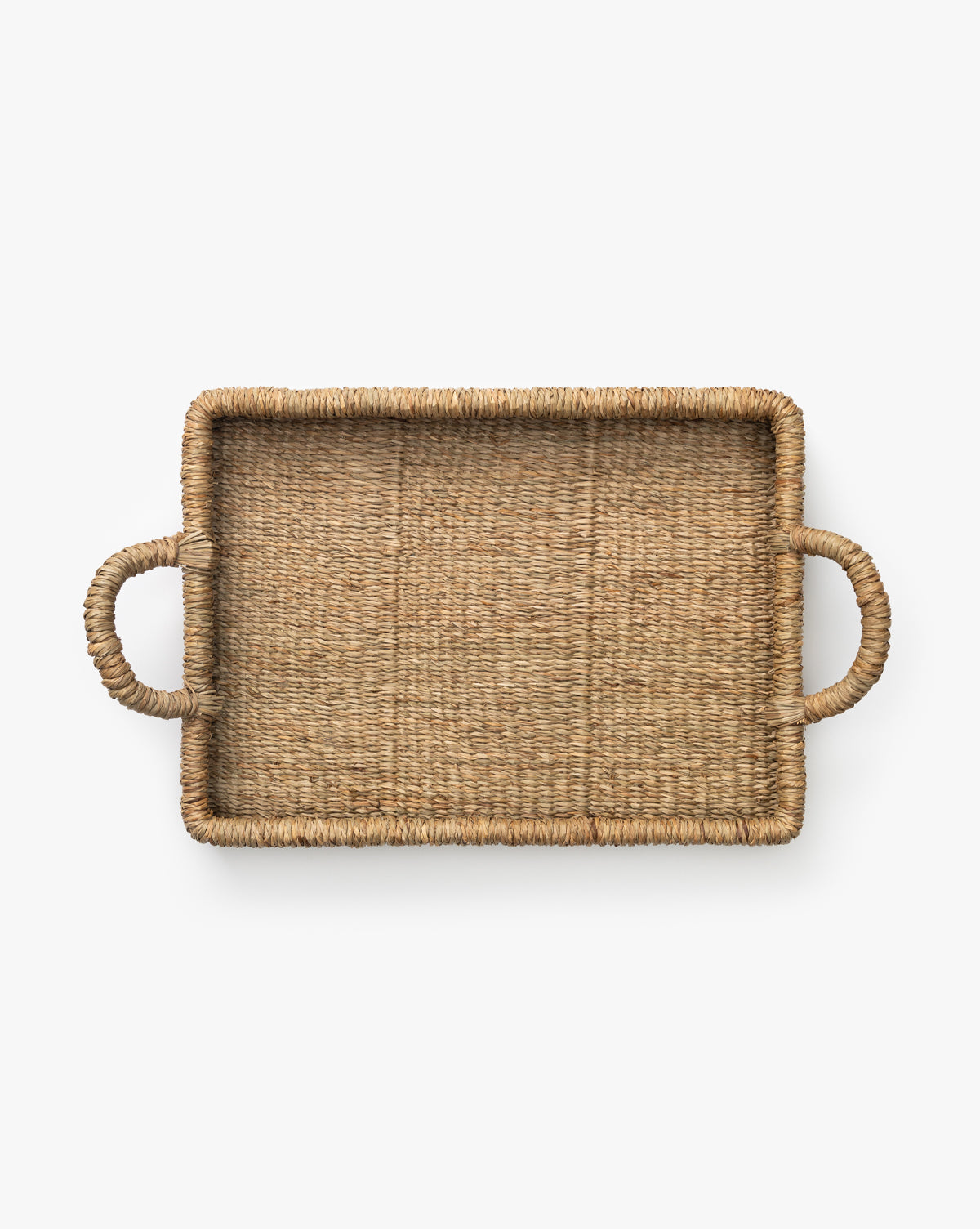 The Liesl Tray is a rectangular woven mendong grass tray with two rounded side handles, ideal for organic home decor and decorative use, shown on a white background.