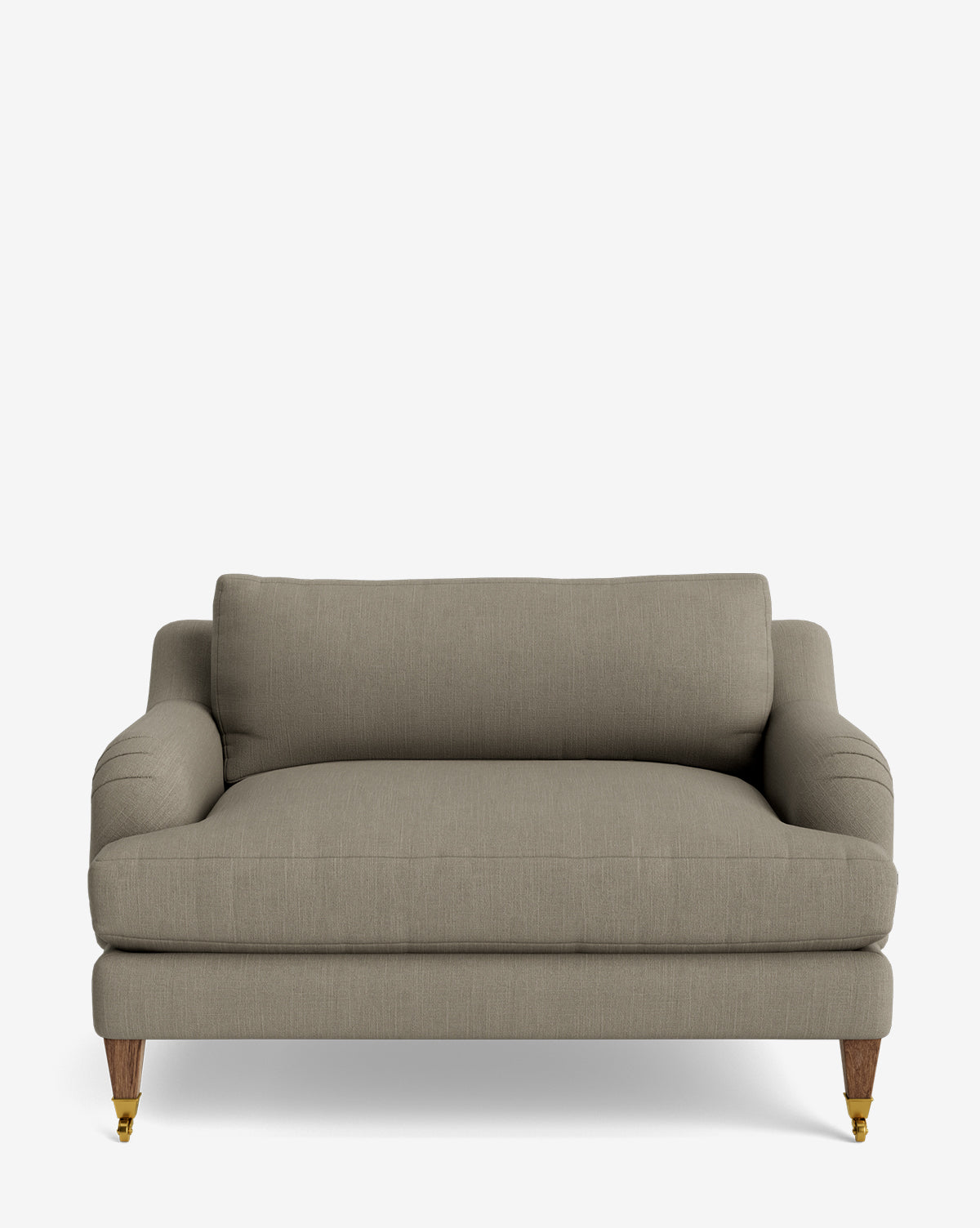 The Lucille English Roll Arm Chair and a Half features taupe upholstery, plush seat and back cushions, curved armrests inspired by the English Roll Arm style, wooden legs, and front brass caster wheels, shown on a plain white background by McGee & Co.