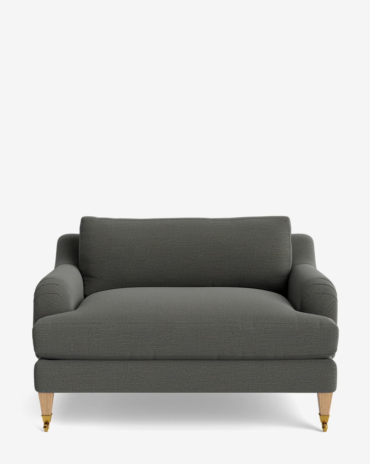 The Lucille English Roll Arm Chair and a Half features dark gray upholstery, a down-wrapped cushion, rounded arms, and light wood legs with front caster wheels, set against a plain white background by McGee & Co.