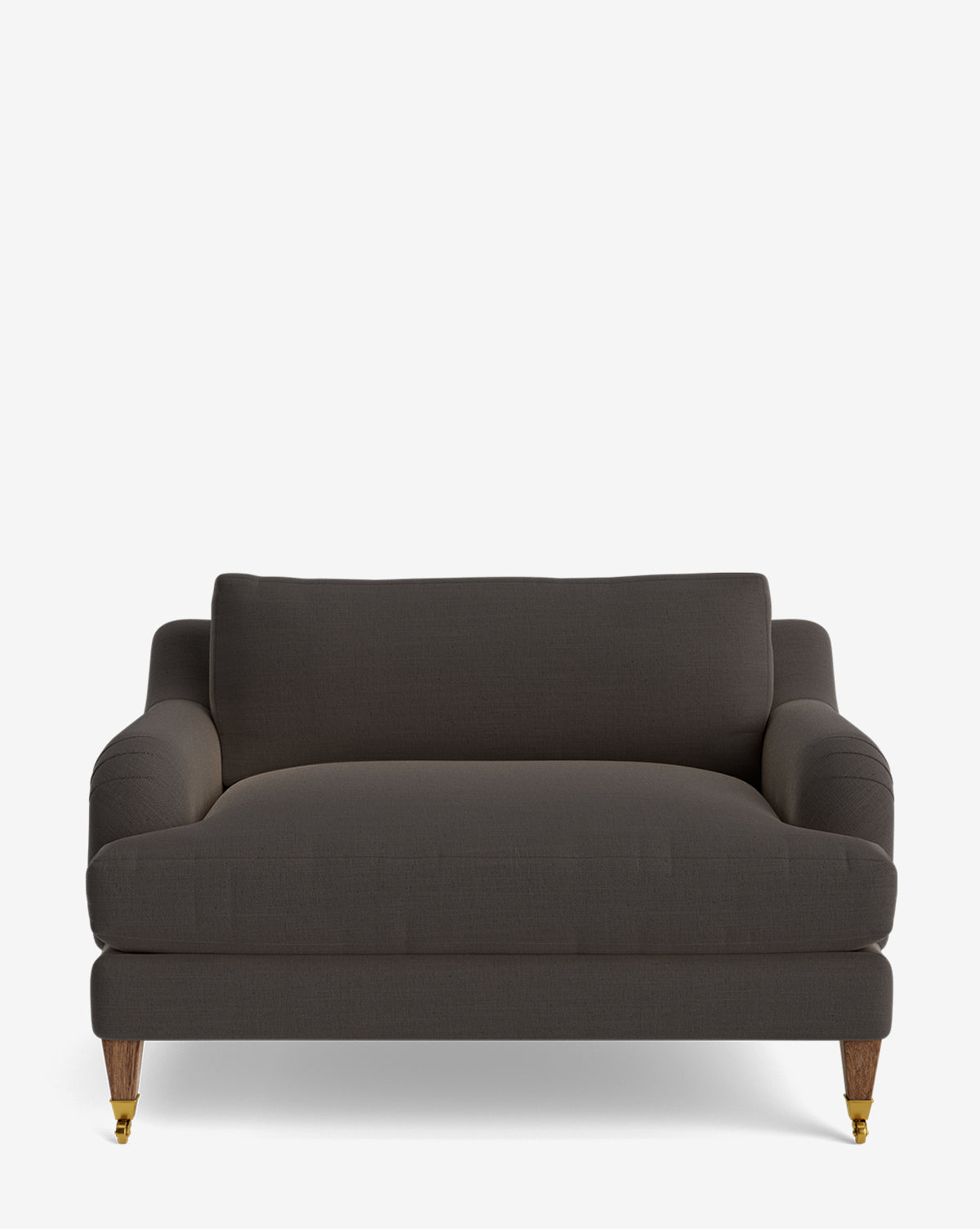 The Lucille English Roll Arm Chair and a Half features dark gray upholstery, curved English roll armrests, a single down-wrapped cushion, and wooden legs—two with brass caster wheels—shown against a plain white background by McGee & Co.