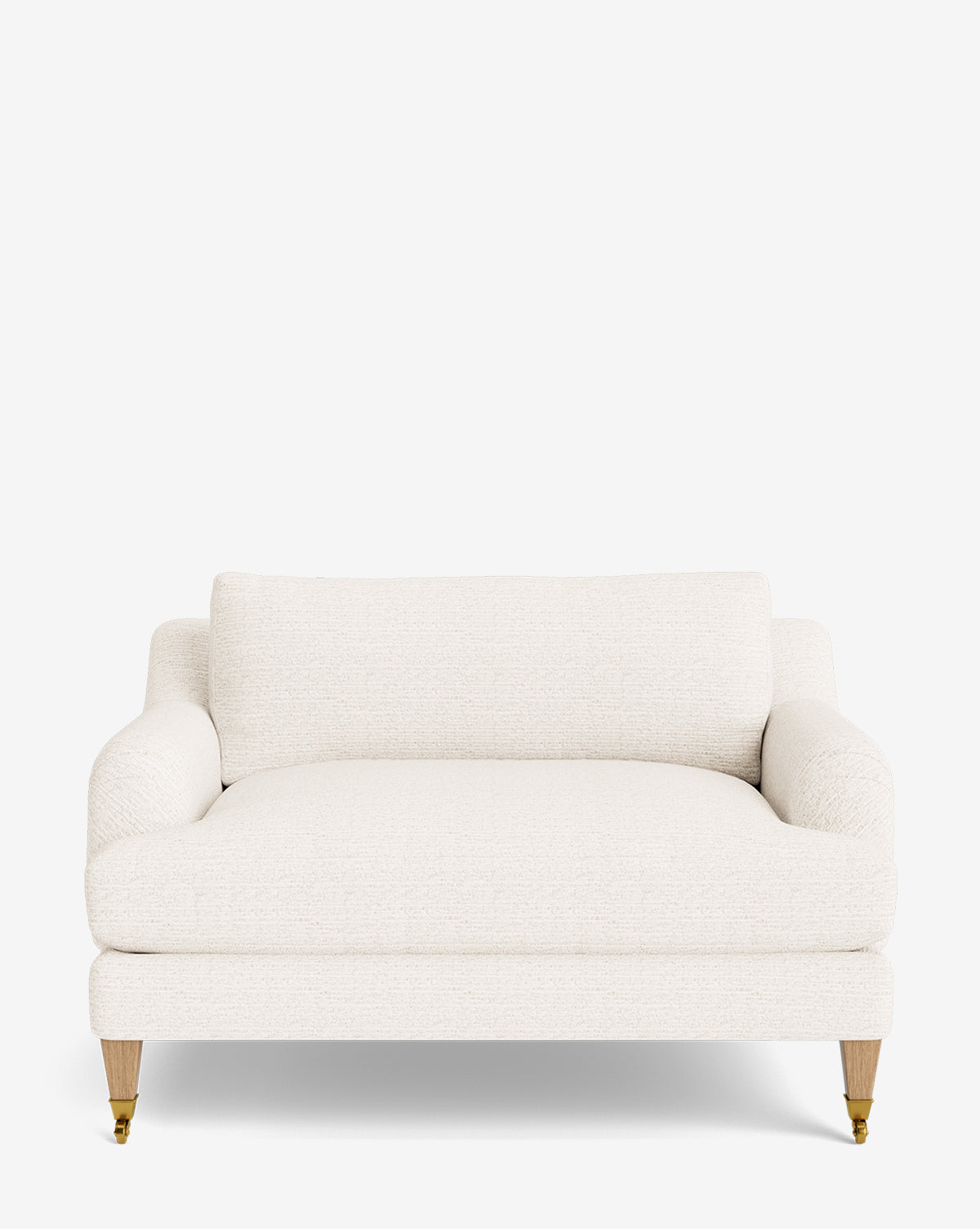 The Lucille English Roll Arm Chair and a Half is cream-colored with rounded arms, down-wrapped cushion, and wooden legs featuring brass castors on the front—shown against a plain white background by McGee & Co.