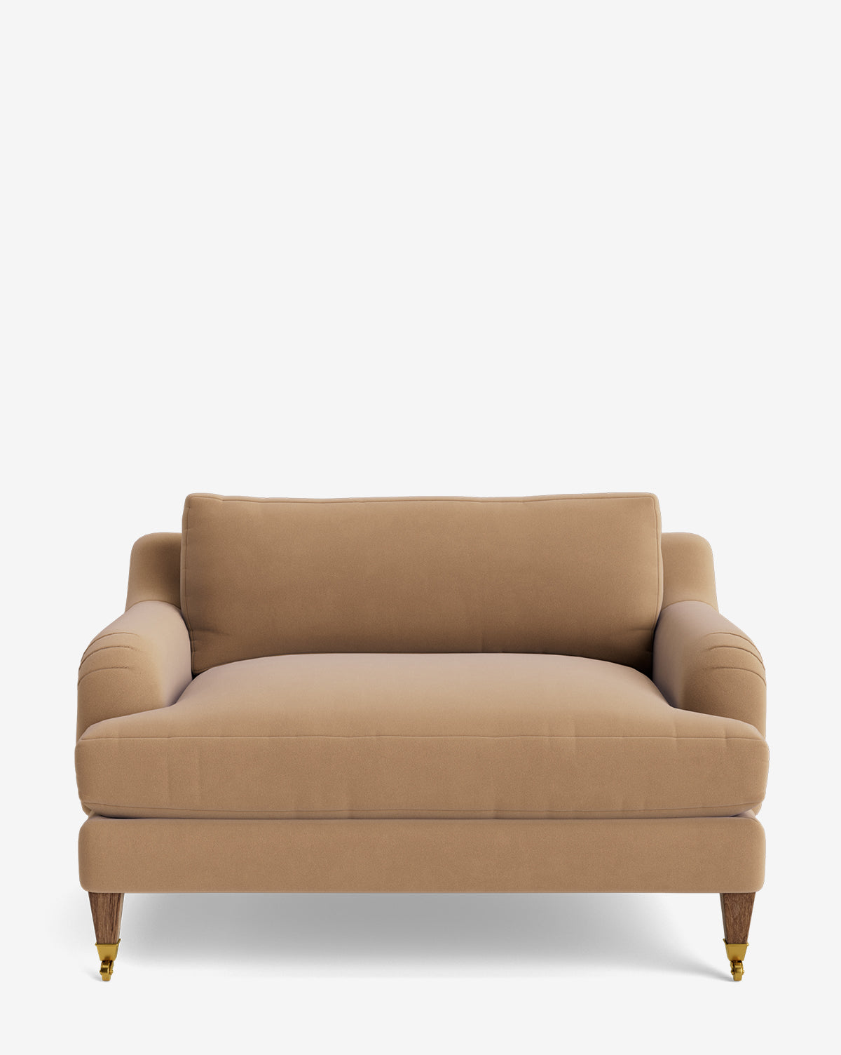 The Lucille English Roll Arm Chair and a Half features tan upholstery, plush down-wrapped cushions, low English roll arms, and exposed wooden legs with brass caster wheels on the front, shown against a plain white background by McGee & Co.