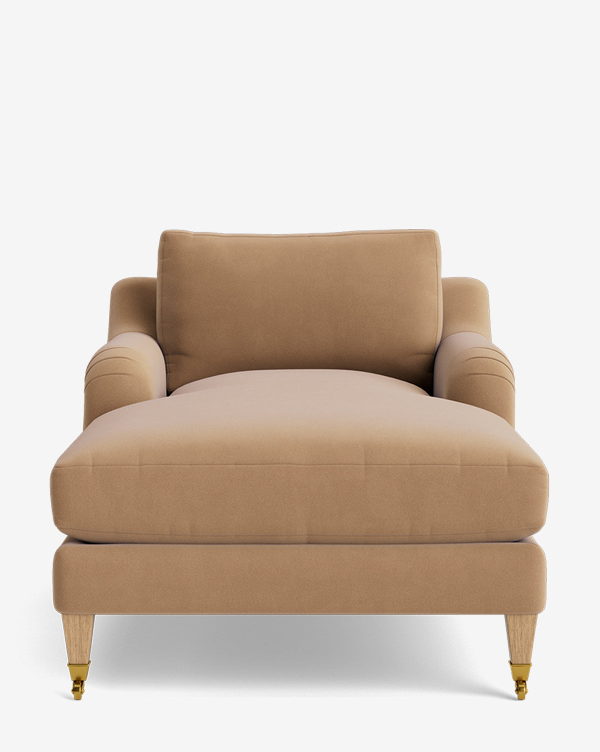 The Lucille English Roll Arm Lounge Chair features tan upholstery, plush down-wrapped cushion, gently rolled arms, and four wooden legs with brass-accented front casters. Also available as a customizable chair by McGee & Co.