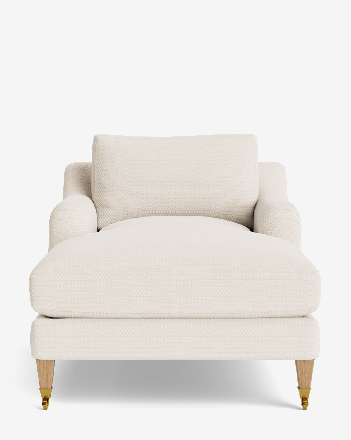 A front view of the Lucille English Roll Arm Lounge Chair, a cream-colored, upholstered chaise with wooden legs and brass casters. This modern piece boasts a wide seat, low English roll arms, and a plush down-wrapped cushion for comfort, by McGee & Co.