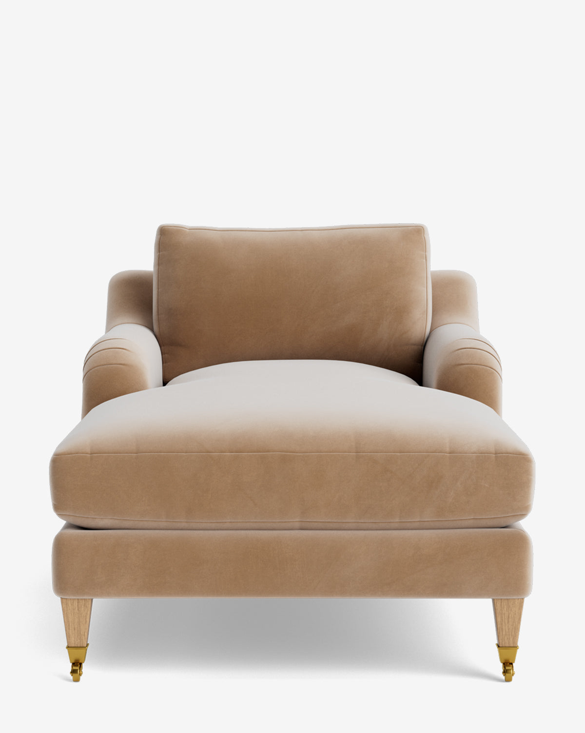 Front view of the Lucille English Roll Arm Chaise Lounge in beige velvet with wooden legs, brass casters on front legs, and a plush down-wrapped cushion, shown against a plain white background by McGee & Co.