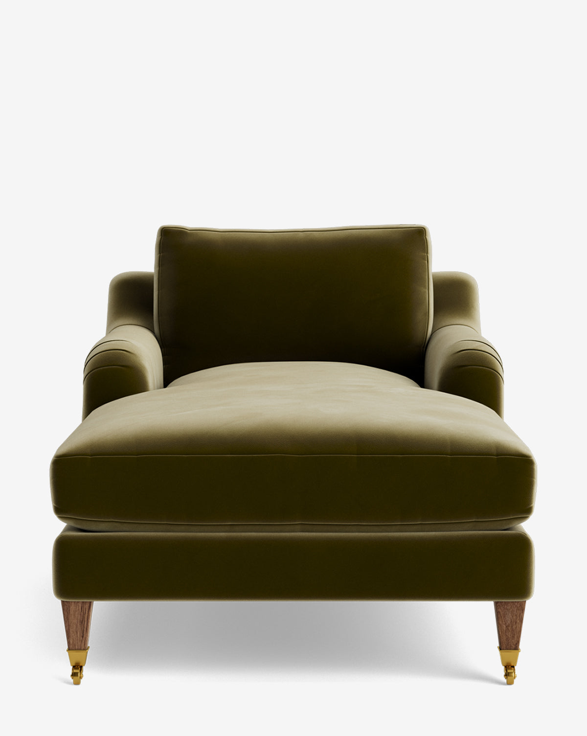 The Lucille English Roll Arm Lounge Chair, shown from the front against a white background, features green velvet upholstery, wooden legs with brass casters, a wide down-wrapped seat cushion, cushioned back, and curved armrests by McGee & Co.