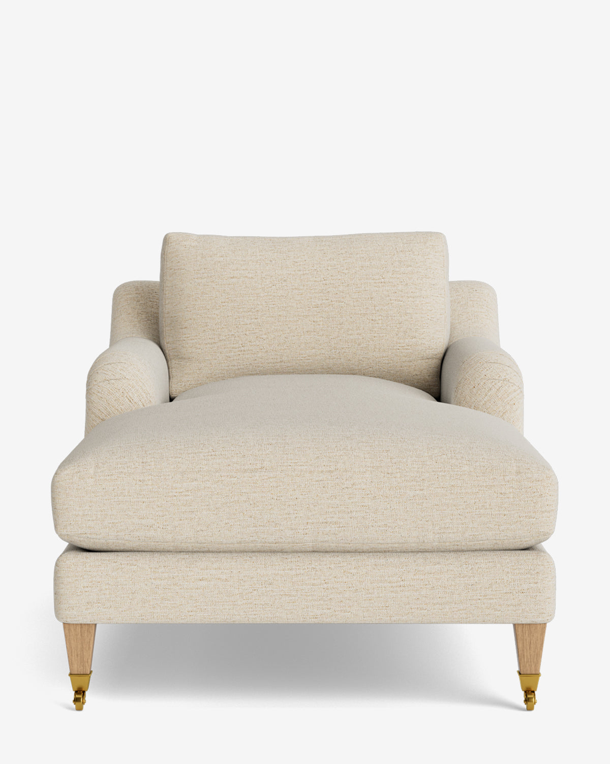 The Lucille English Roll Arm Chaise Lounge features wide beige upholstery, plush down-wrapped cushions, two armrests, and wooden legs with front brass casters. Shown against a plain white background, its inspired by classic English design by McGee & Co.