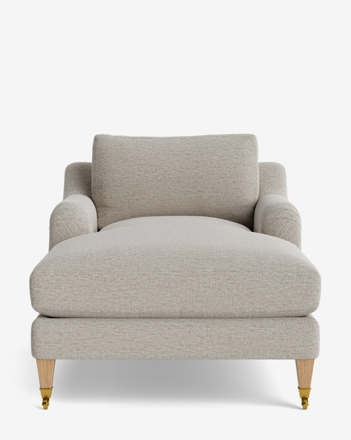 The Lucille English Roll Arm Lounge Chair is a customizable, beige upholstered chaise with a wide down-wrapped seat cushion, cushioned backrest, and wooden legs—front legs feature brass casters. Its design is modern and minimalist by McGee & Co.