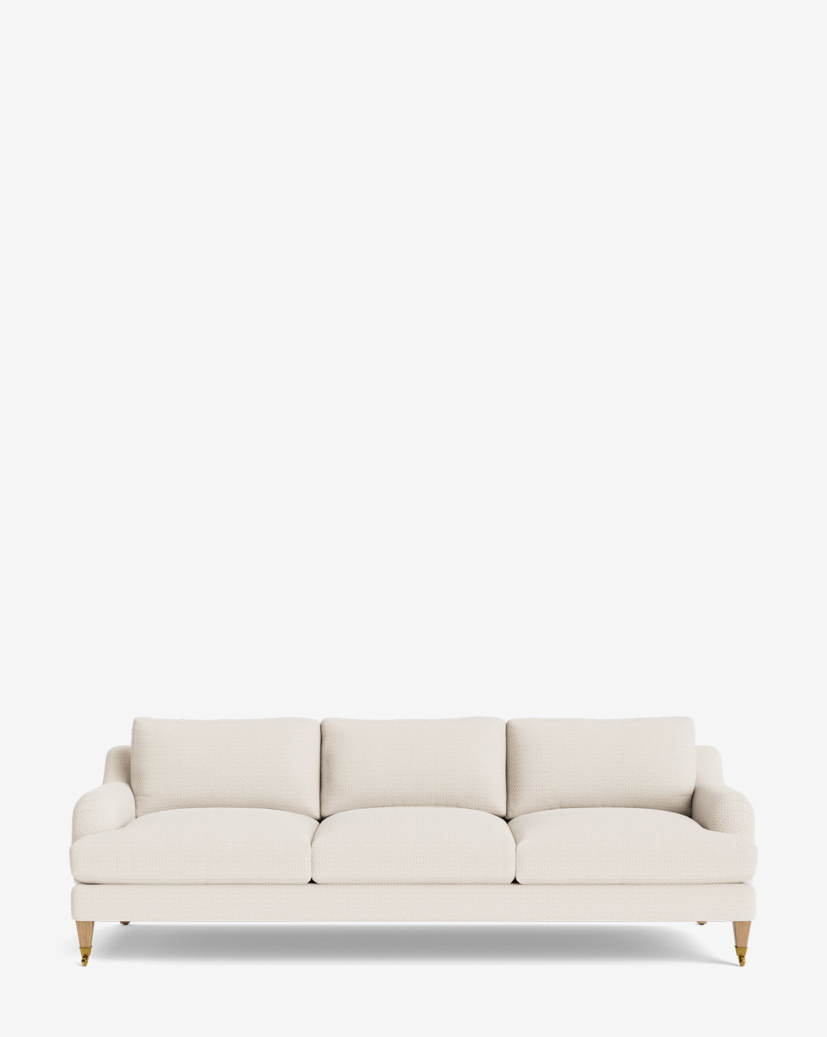 The Lucille English Roll Arm Sofa 90.5 features light beige upholstery, three down-wrapped seat cushions, rounded arms, and wooden legs with brass wheels, all set against a plain white background by McGee & Co.