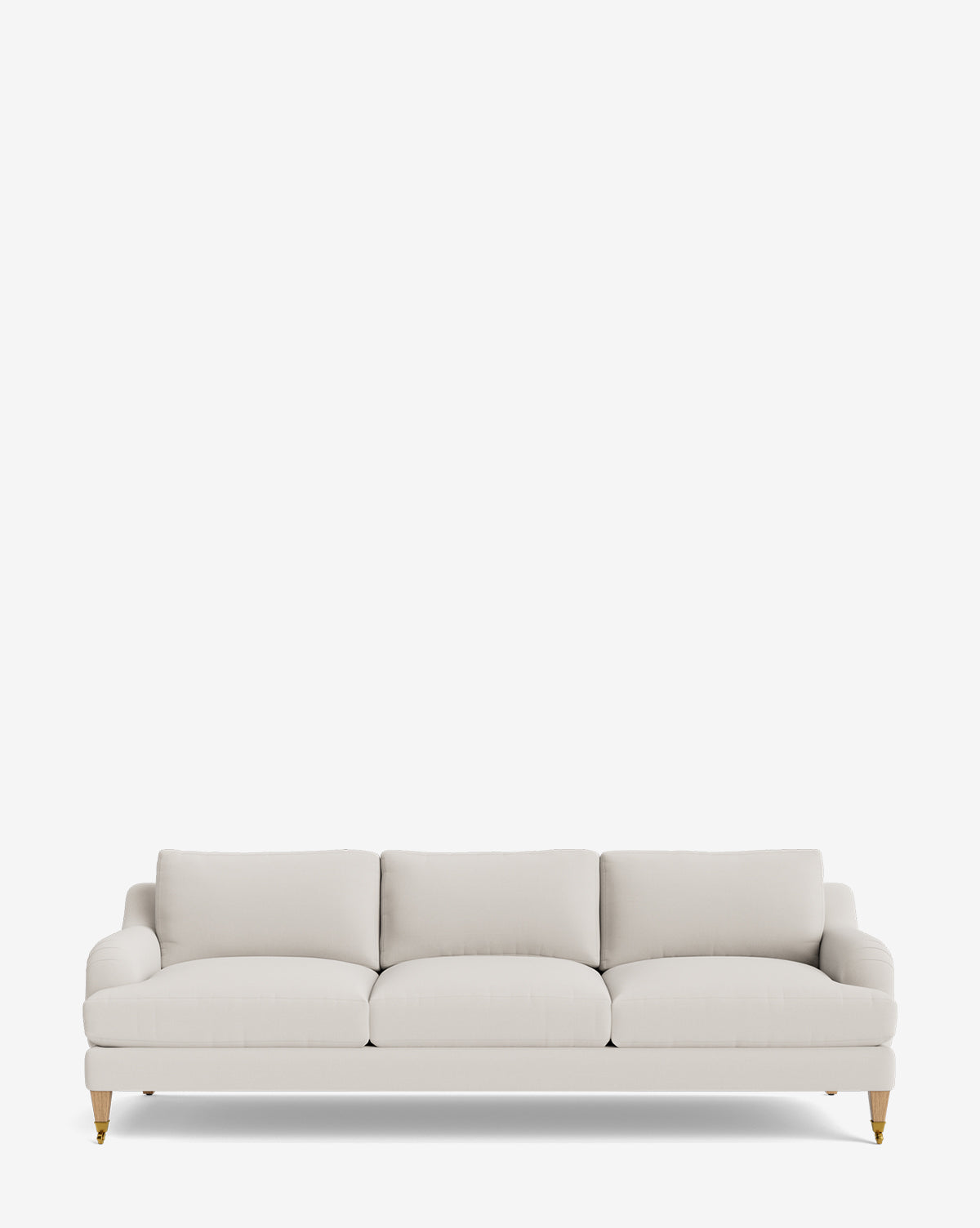 The Lucille English Roll Arm Sofa 90.5 features light beige upholstery, down-wrapped cushions, rounded armrests, and short wooden legs with brass casters, shown against a plain white background by McGee & Co.