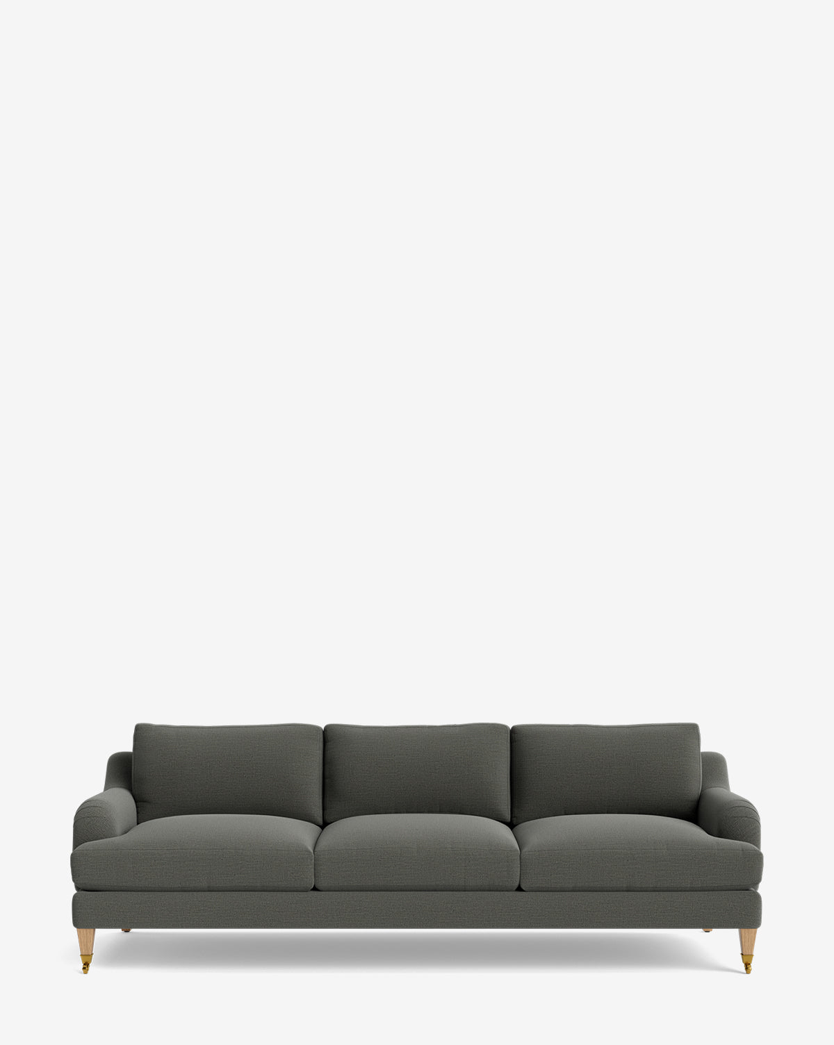 The Lucille English Roll Arm Sofa 90.5 is a dark gray, three-seater with down-wrapped cushions and wooden legs with brass caster wheels, shown against a plain white background by McGee & Co.