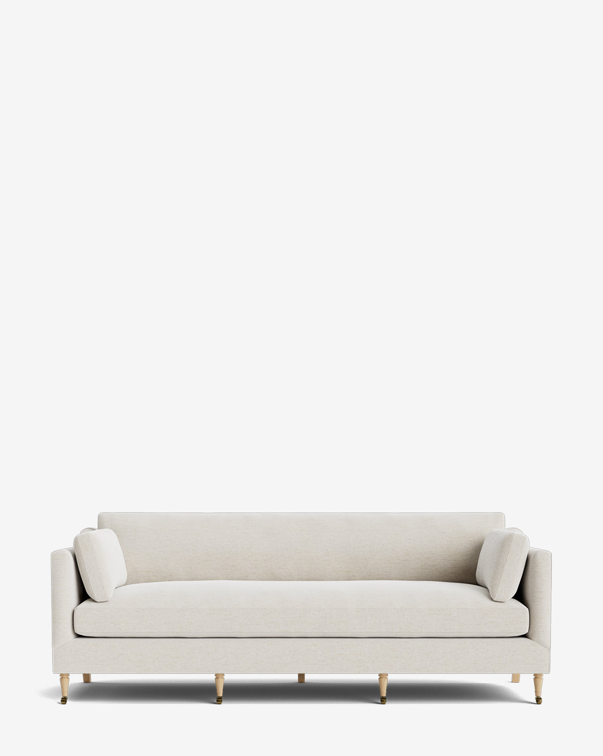 The Haverford Upholstered Sofa 90 is a modern, light beige sofa featuring straight arms, two cylindrical bolster pillows, and slender gold-capped legs, shown against a plain white background by McGee & Co.