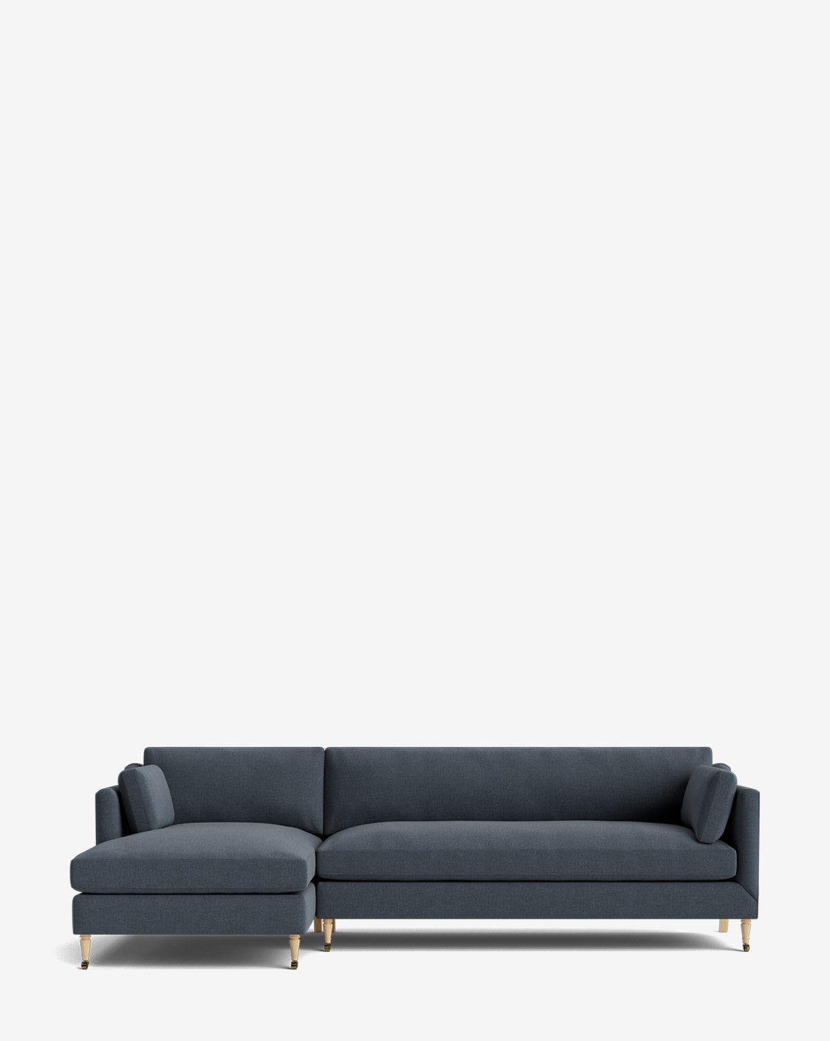 The Haverford Upholstered Left Chaise Sectional by Rowe Fine Furniture features dark blue fabric, gold legs, a left chaise, and two matching cylindrical pillows, shown on a plain white background. McGee & Co.