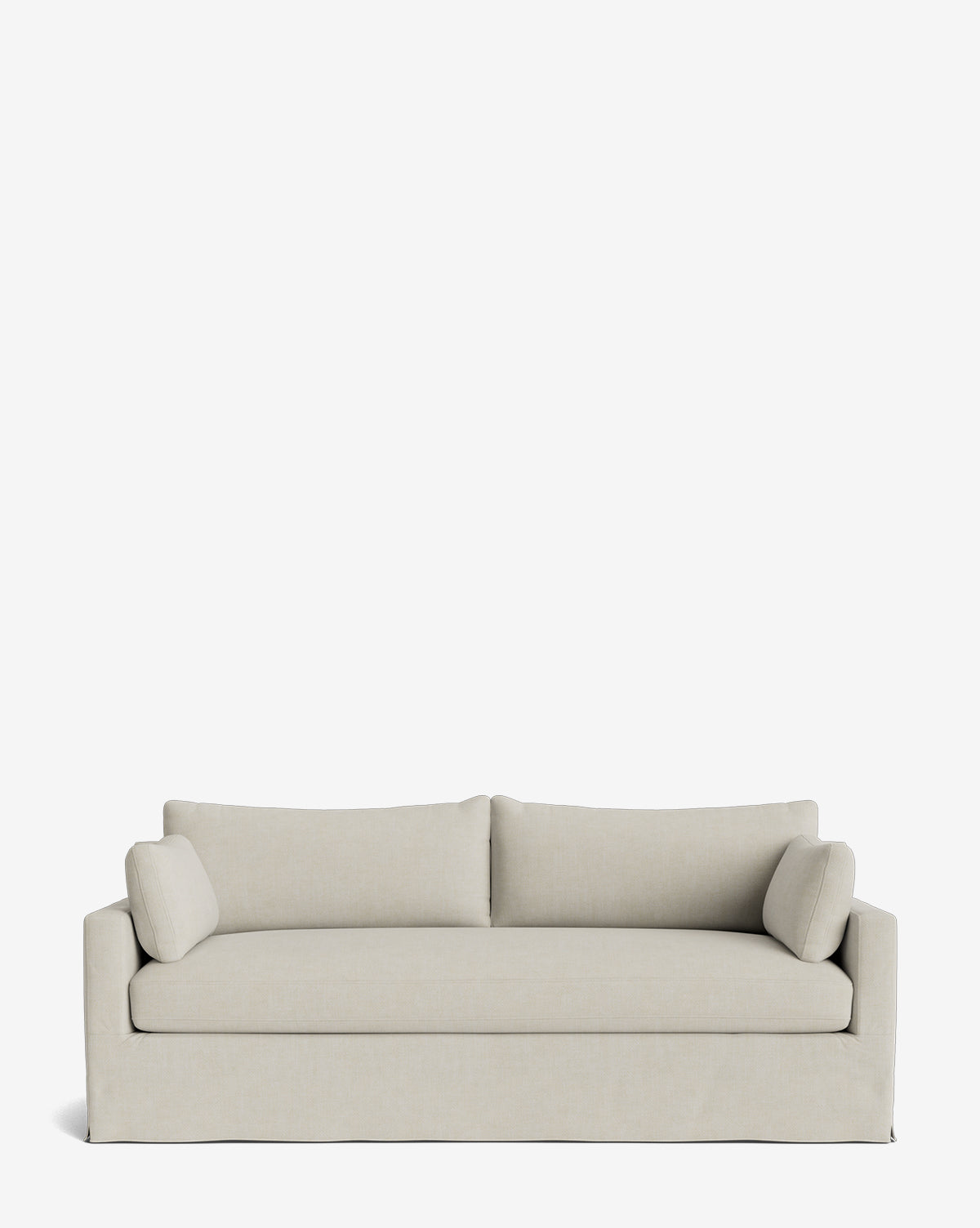 The Peterson Classic Slipcover Sofa (75-100) by Rowe Fine Furniture features a modern beige boxy design, two back cushions, feather blend seating, and two cylindrical side pillows, displayed against a white background. McGee & Co.