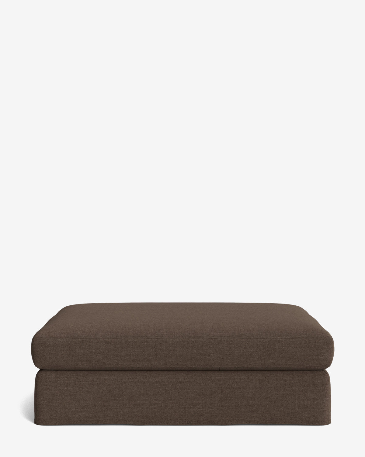 The Macy Slipcover Ottoman is a rectangular, customizable brown upholstered piece with a simple modern design, making it versatile living room furniture, shown against a plain white background by McGee & Co.