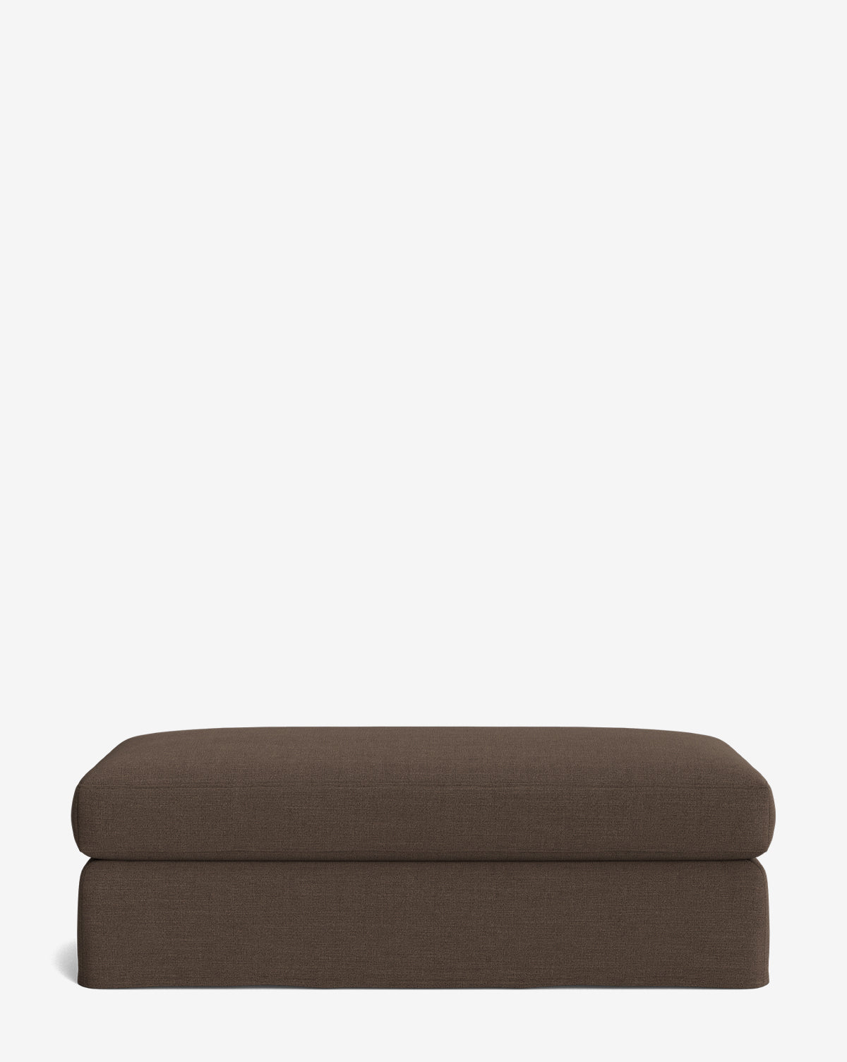 The Macy Slipcover Ottoman is a rectangular, brown ottoman with clean lines, ideal for living room decor, shown against a plain white background, by McGee & Co.