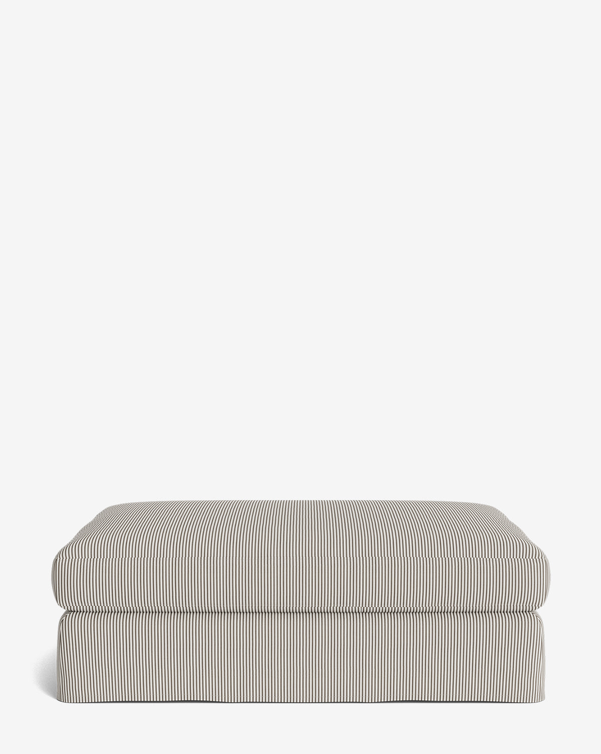The Macy Slipcover Ottoman features a thick cushion and fabric with thin vertical black and white stripes, making it a customizable rectangular addition to your living room décor, by McGee & Co. Shown against a plain white background.