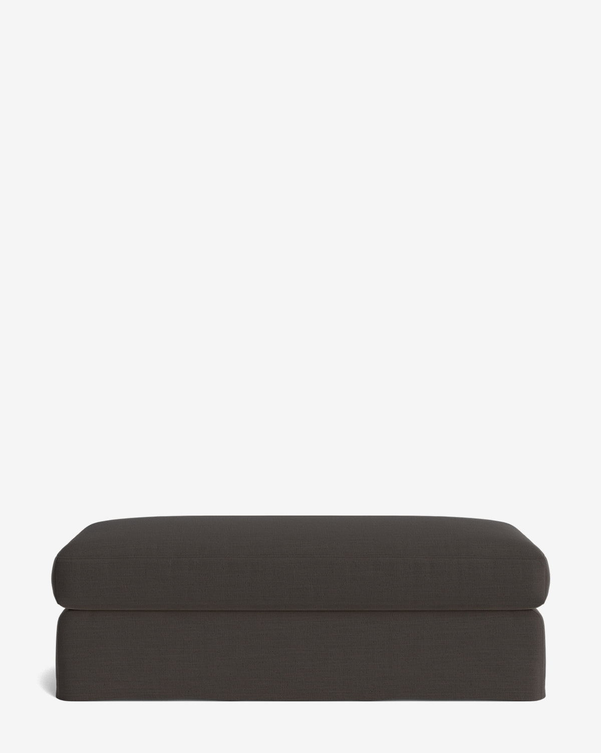 The Macy Slipcover Ottoman features a rectangular, dark gray design with modern simplicity, making it a versatile addition to any living room, by McGee & Co. Pictured against a plain white background.