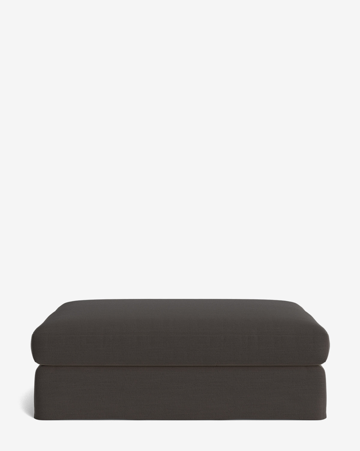The Macy Slipcover Ottoman, featuring a rectangular shape and dark gray color, offers a simple modern design ideal for versatile living room use, by McGee & Co. Shown against a plain white background.