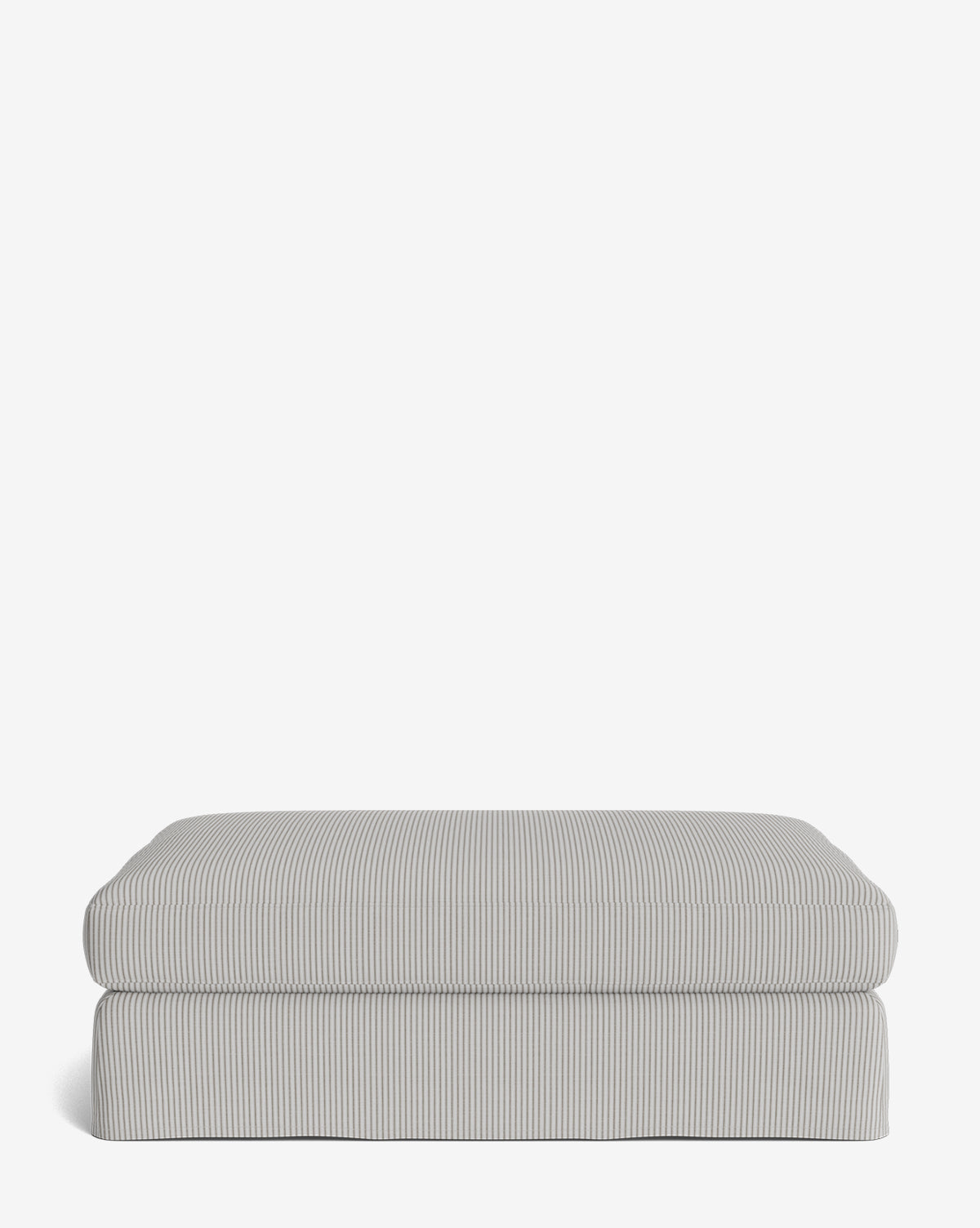 The Macy Slipcover Ottoman, upholstered in light gray and white pinstriped fabric, adds stylish flair to your living room decor and is shown here against a plain white background, by McGee & Co.