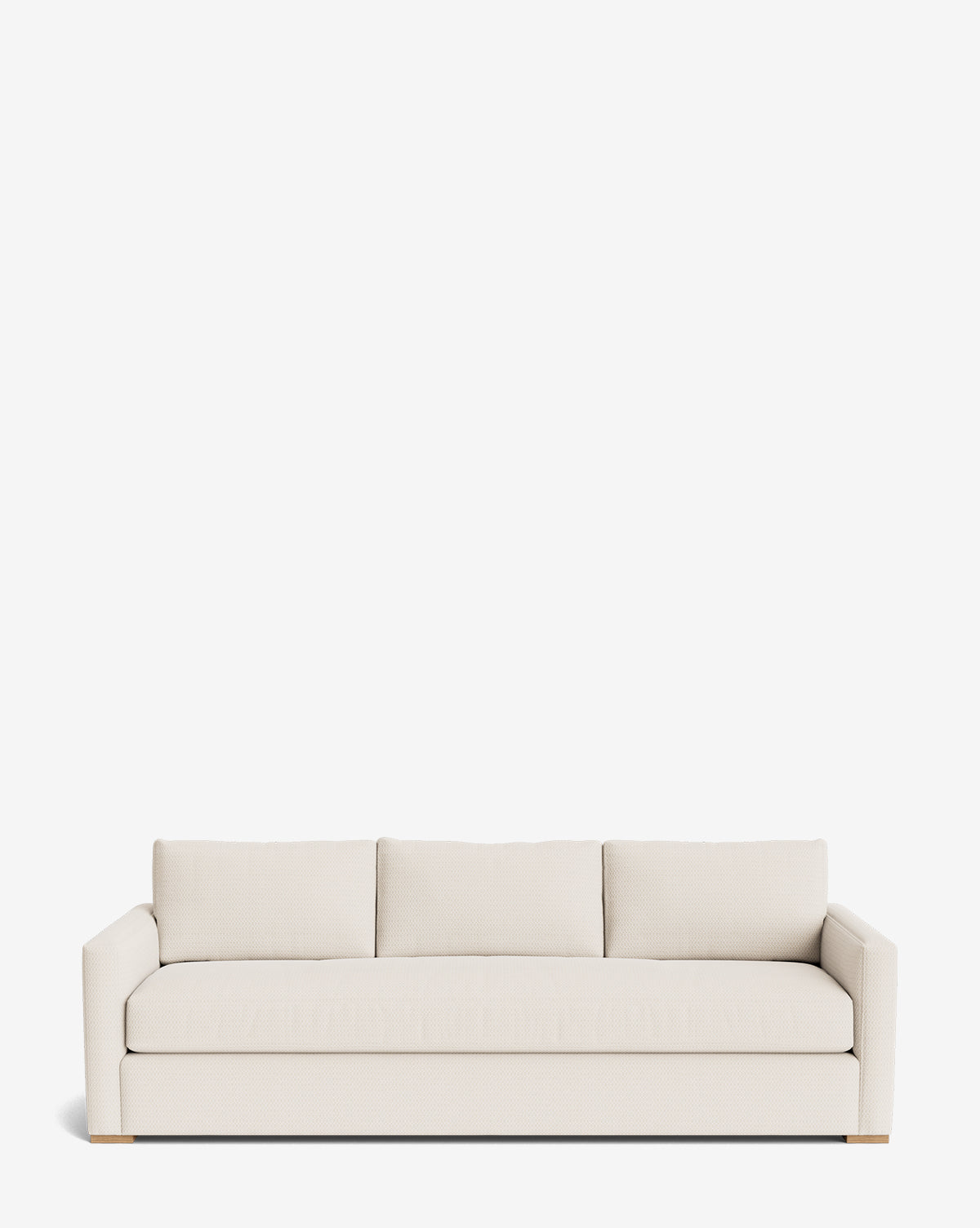 The Macy Upholstered Sofa (84-96) features a modern, minimalist design in light beige with three seat and back cushions, straight arms, and wooden legs—an ideal centerpiece for any living room, by McGee & Co.