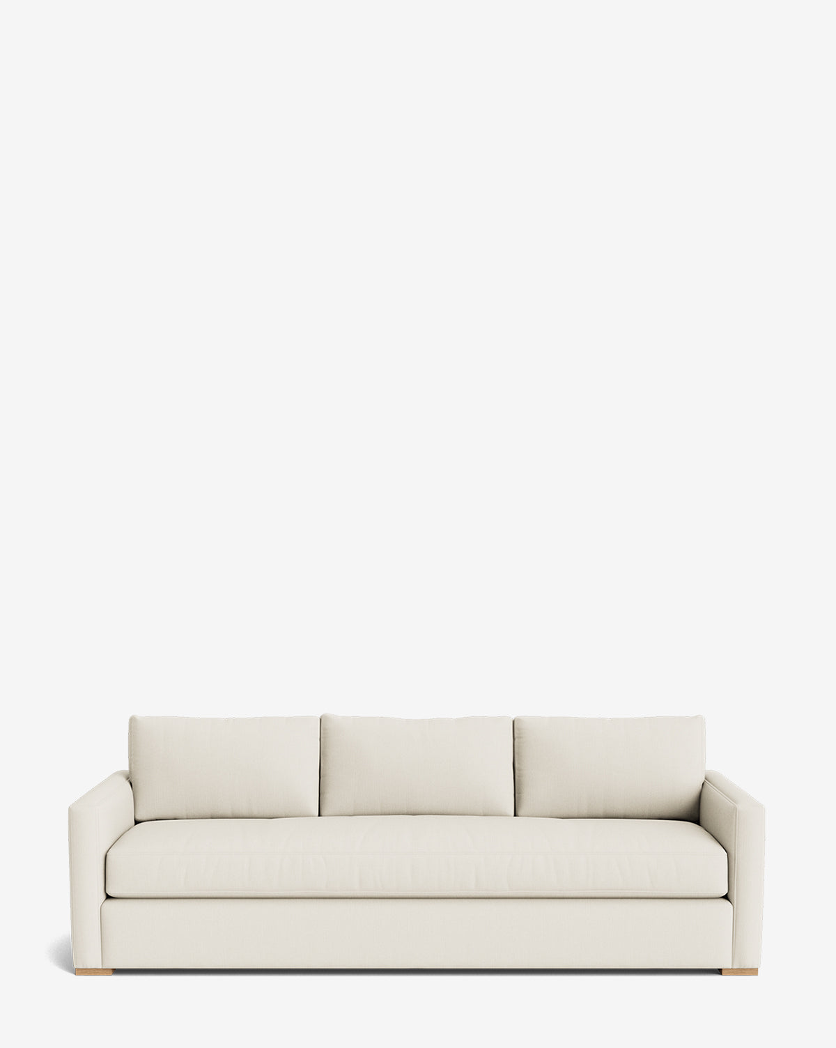 The Macy Upholstered Sofa (84-96) is a modern three-seater with clean lines, light beige fabric, three back cushions, and low square arms—an elegant living room piece shown against a plain white background, by McGee & Co.