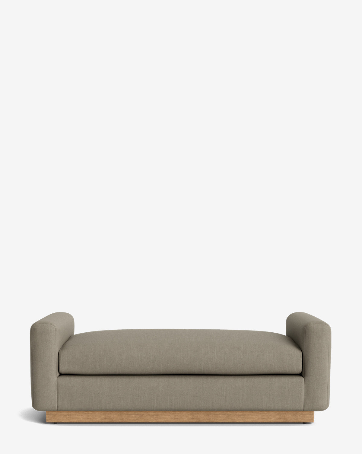 The Mansfield Bench features a modern, low-profile design with light brown fabric upholstery, wide arms, and a wooden base, offering refined elegance reminiscent of an upholstered bench against a plain white background, by McGee & Co.