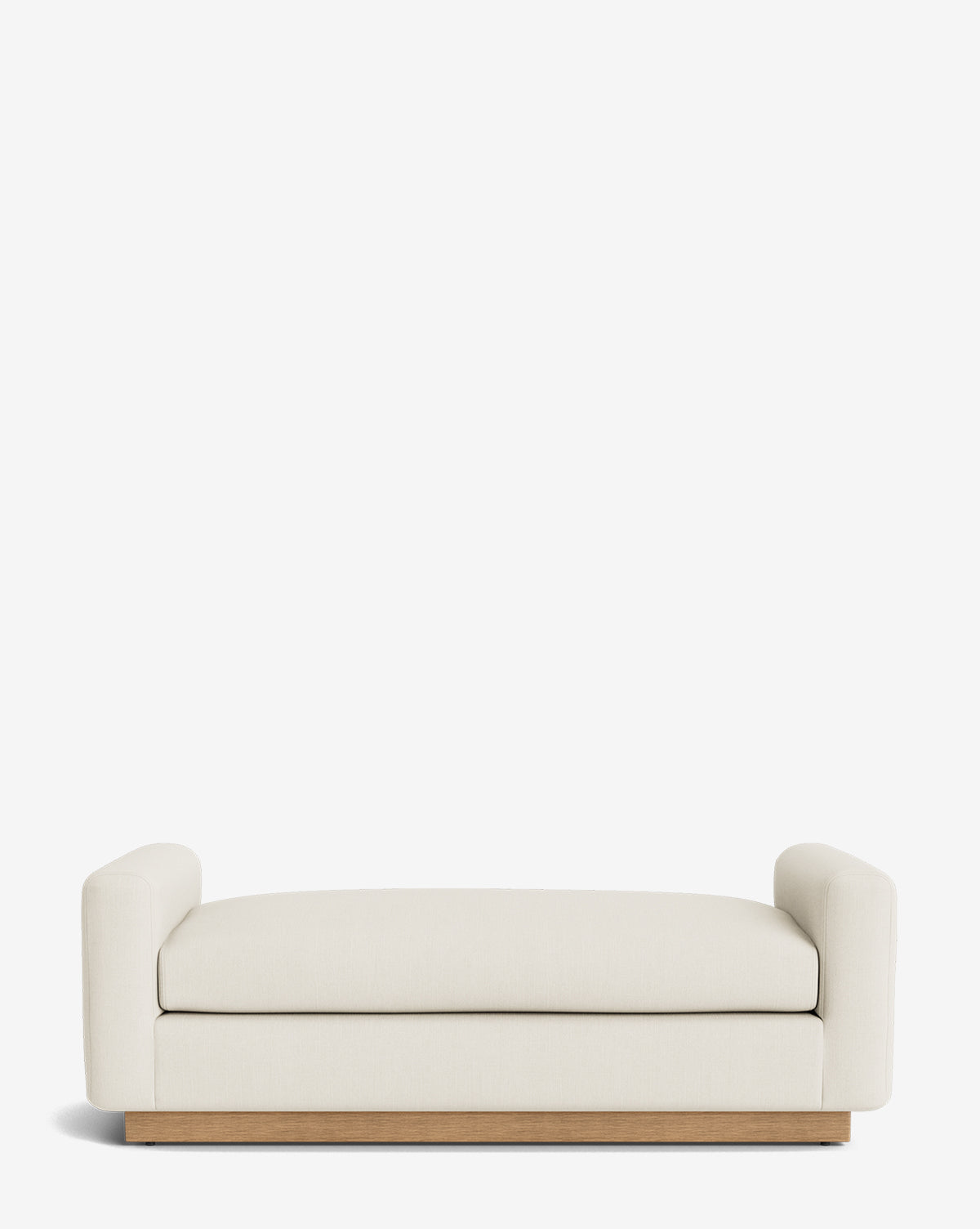 The Mansfield Bench is a modern cream-colored seat with low, rounded arms and a wooden base, evoking timeless elegance against a plain white background, by McGee & Co.