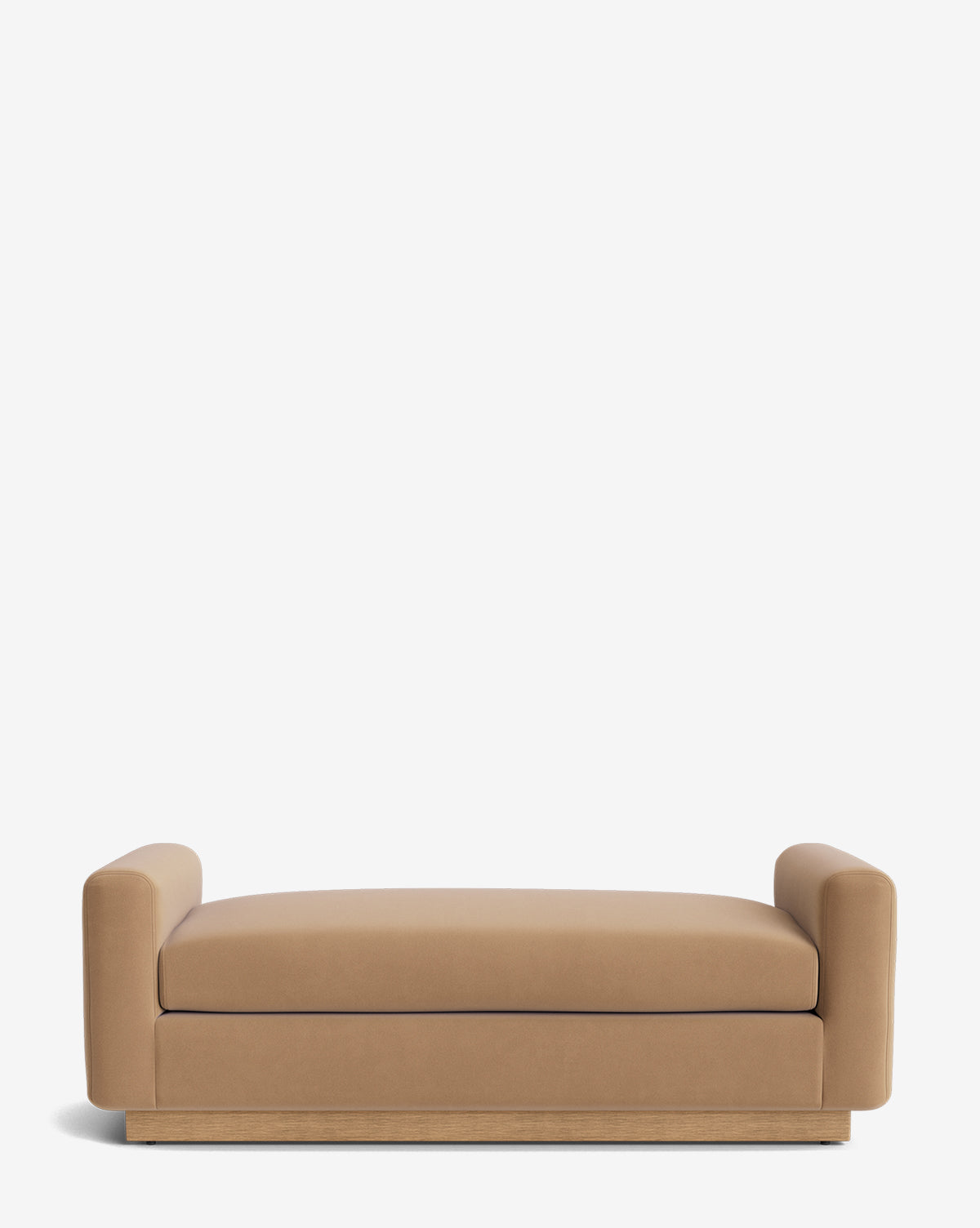 The Mansfield Bench features tan upholstery with low cylindrical armrests and a thick seat cushion, all set on a wooden base. Shown against a plain white background by McGee & Co.
