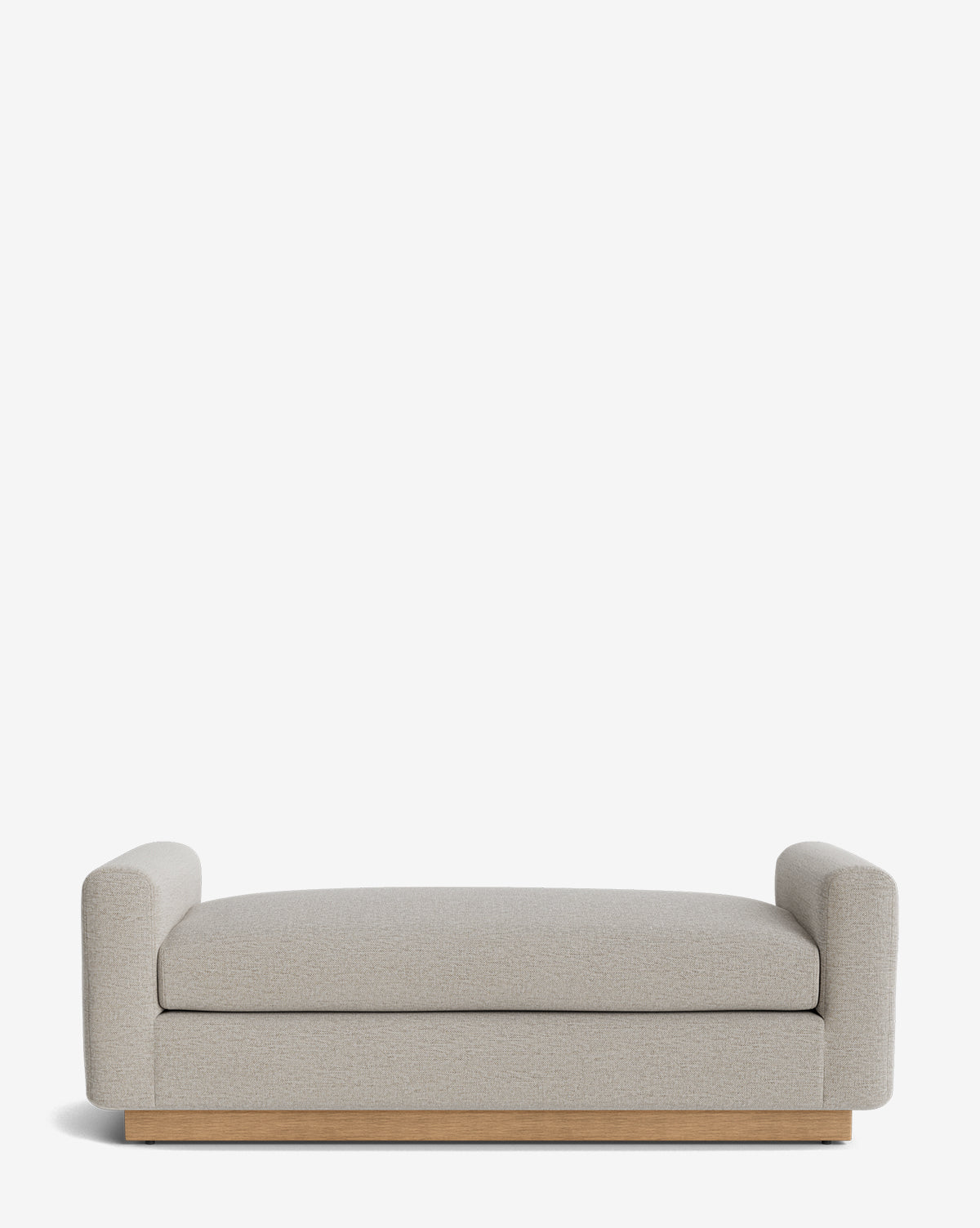 The Mansfield Bench features modern styling with a light gray upholstered seat, low cylindrical armrests at each end, and a wooden base, shown against a plain white background by McGee & Co.