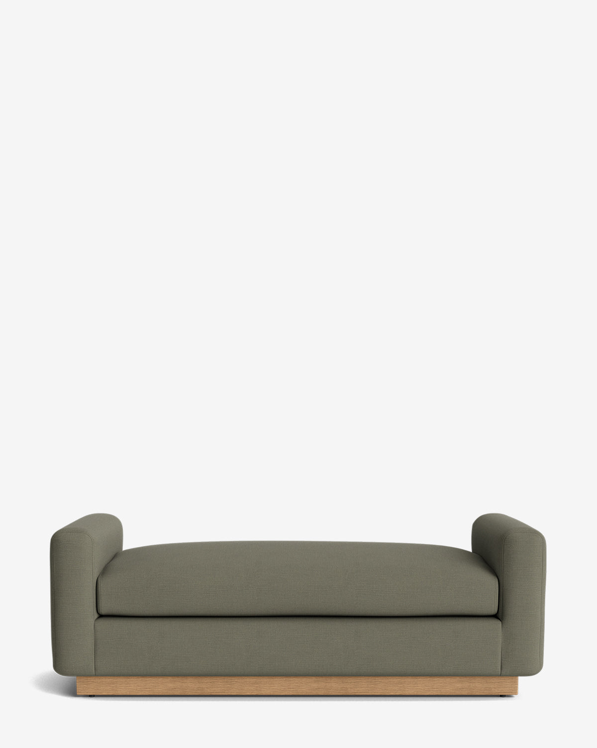 The Mansfield Bench is a modern olive green sofa with low, rounded arms and a wooden base, reminiscent of a handcrafted bench, displayed against a plain white background, by McGee & Co.