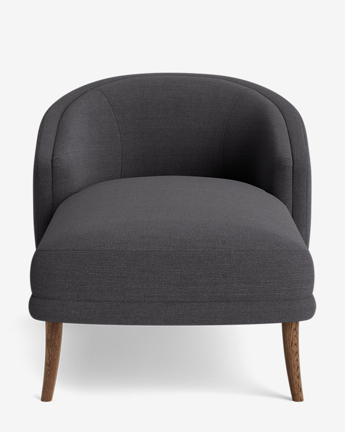 The Marguerite Chaise Lounge is a modern, dark gray upholstered armchair with a rounded backrest and wooden legs, shown from the front on a white background by McGee & Co.