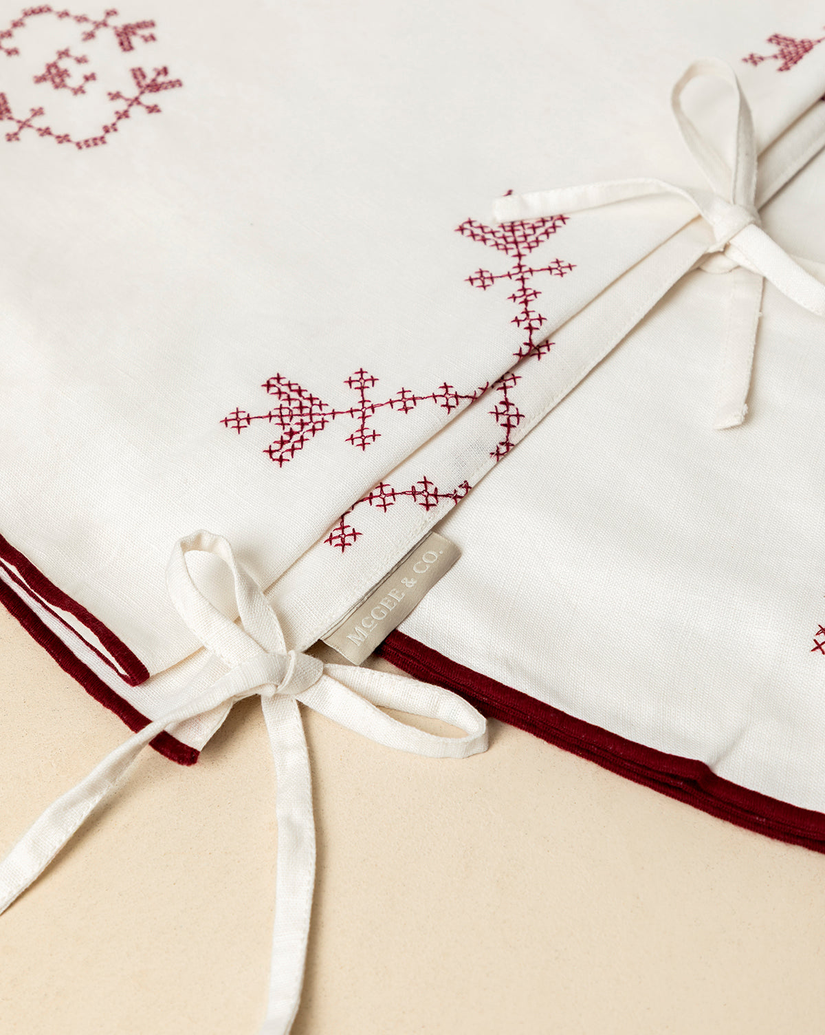 A woven MIGUEL & CO. label adds heirloom charm, making this piece ideal for holiday decor or as a vintage tree skirt, by McGee & Co.