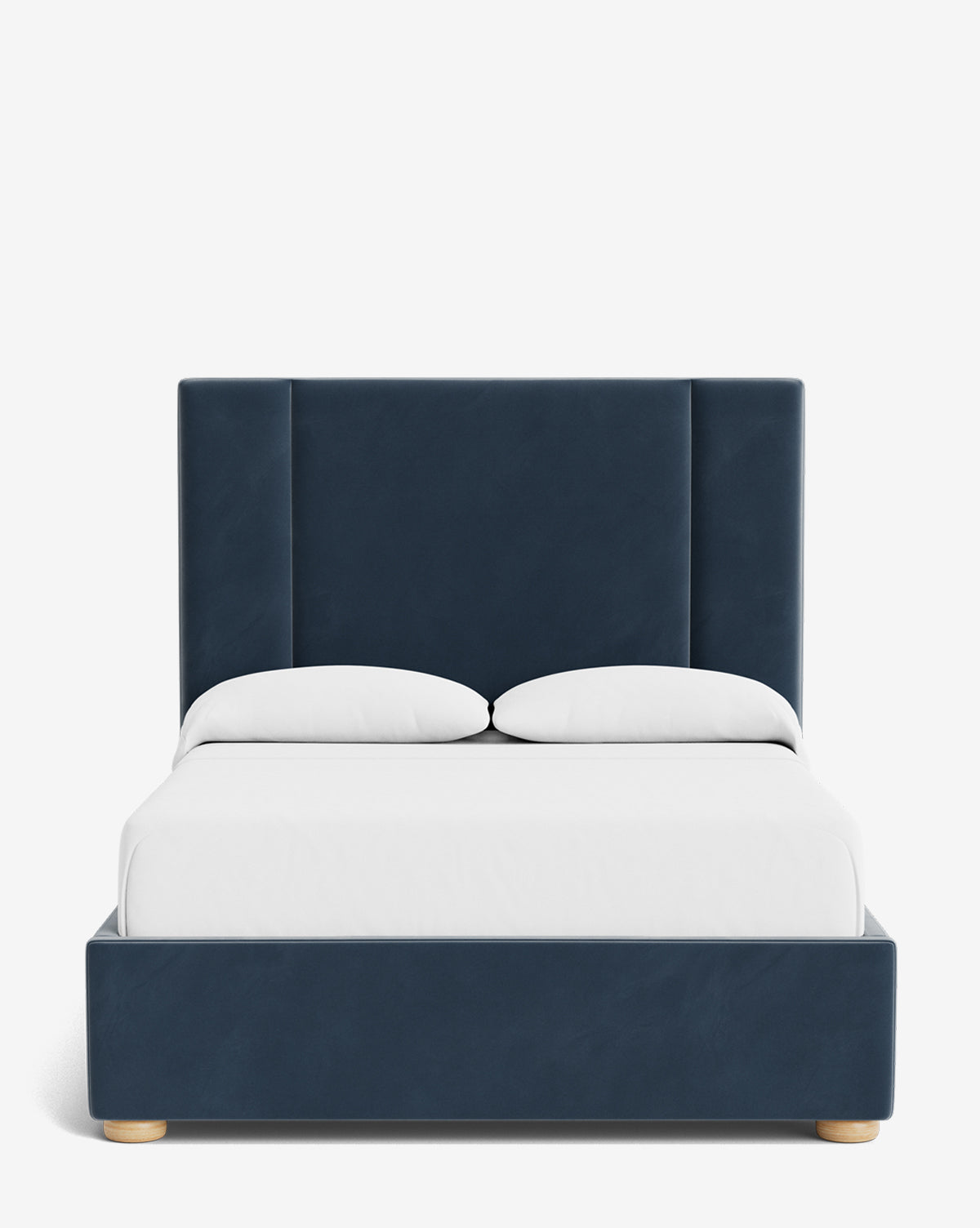The Mina Bed showcases a modern look with its tall, navy blue upholstered frame made from premium fabric, paired with white linens and two pillows, all set against a plain white background, by McGee & Co.