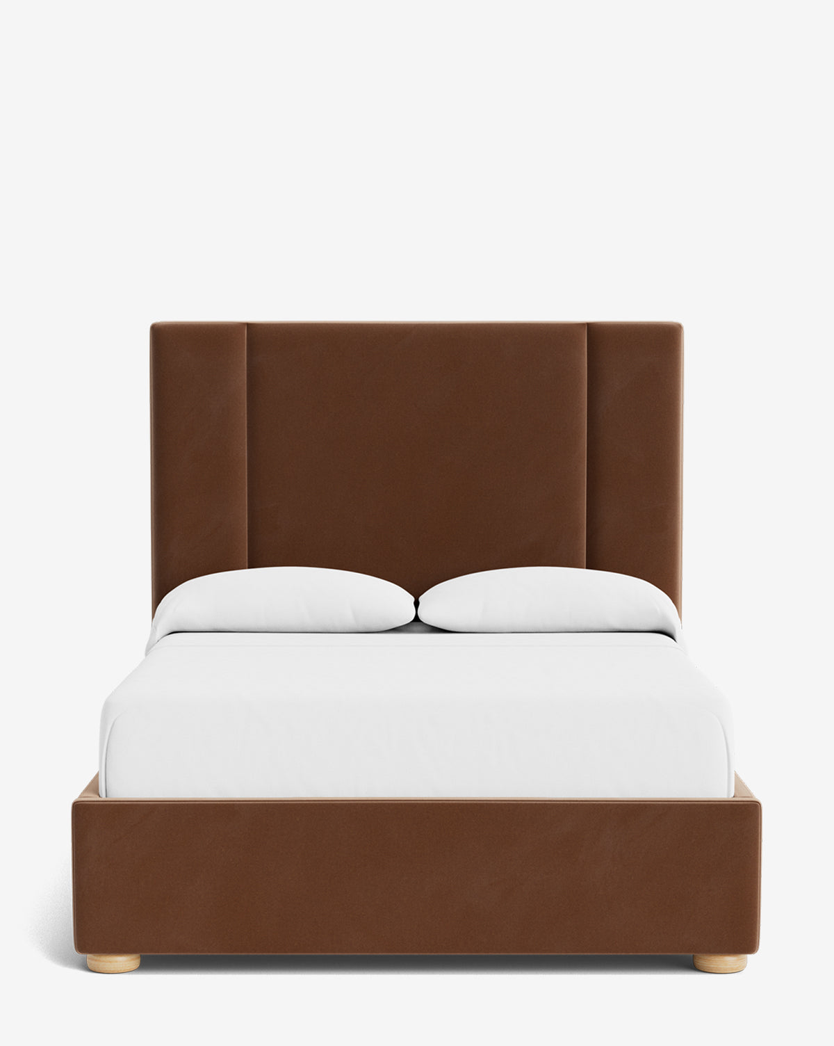 The Mina Bed features a tall brown upholstered headboard, matching frame, and light wooden legs. It is shown with a white fitted sheet, white blanket, and two white pillows, by McGee & Co.