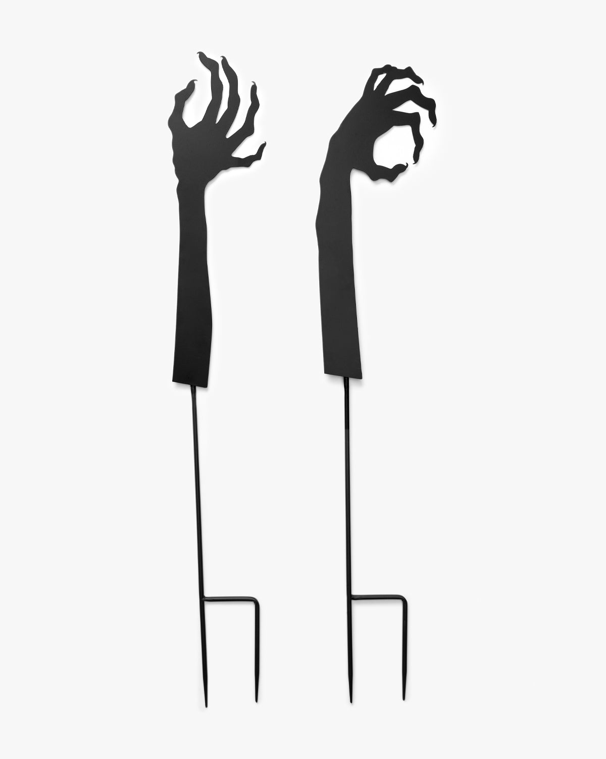 Creative Co-op’s Monster Hands Yard Stakes (Set of 2) feature black, clawed zombie arms for spooky Halloween yard décor that will frighten and delight your guests—now with a touch of style inspired by McGee & Co.