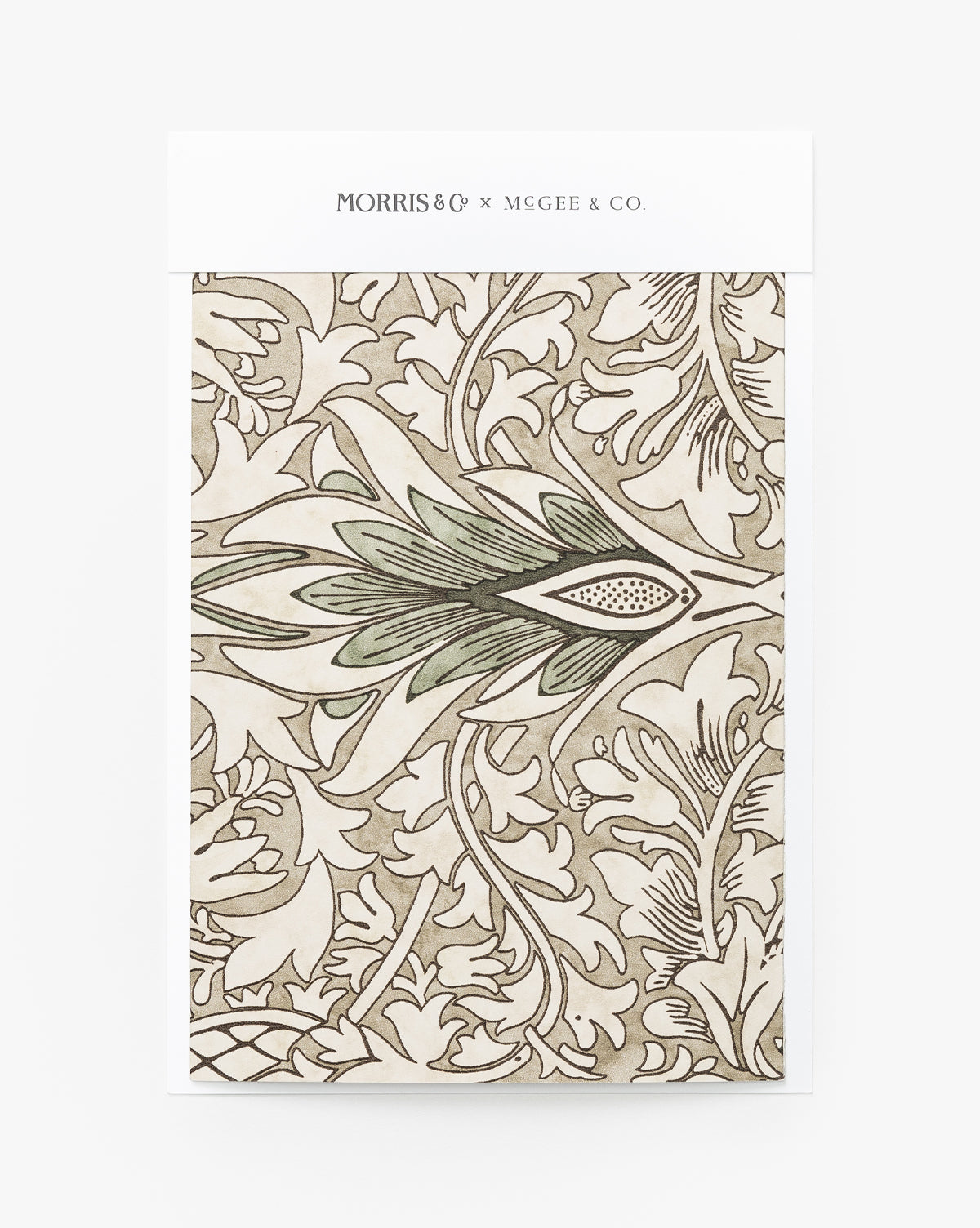 A wallpaper swatch featuring an intricate, vintage-inspired leafy Snakeshead pattern in beige, green, and cream by Sanderson Design Group, Inc., from the Morris & Co. x McGee & Co. collaboration. McGee & Co.