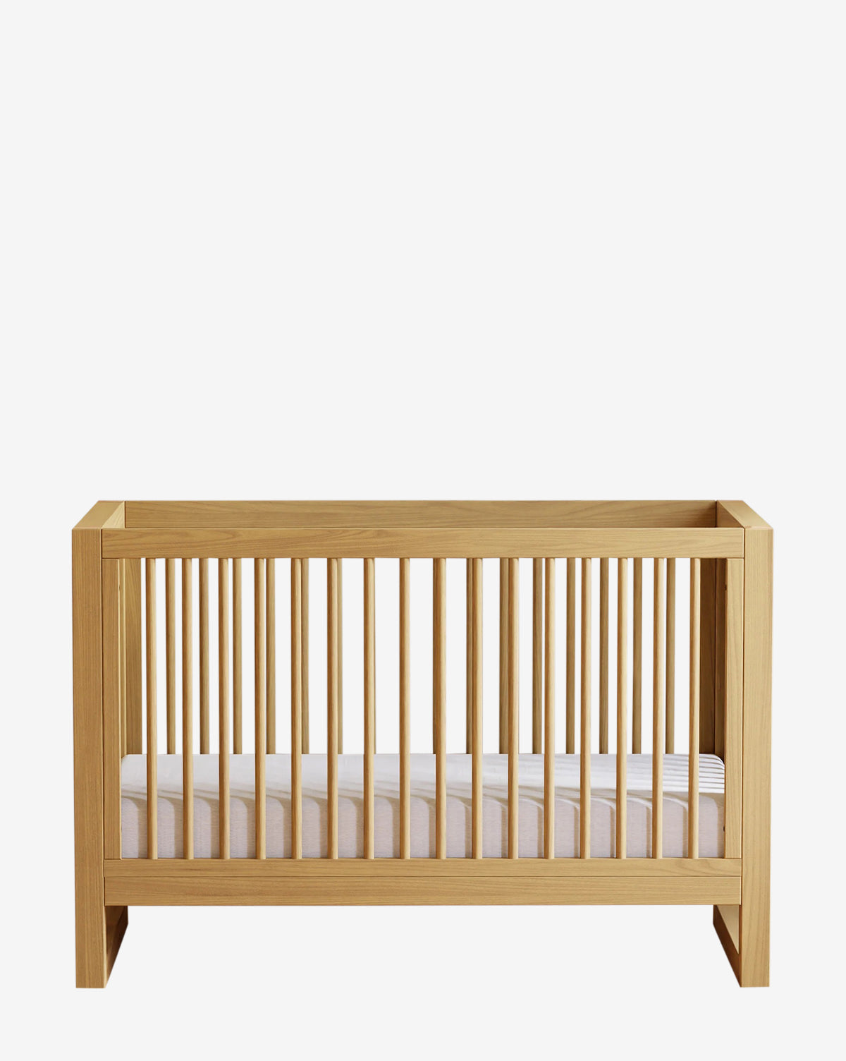 The Nantucket 3-in-1 Convertible Crib with Toddler Bed Conversion Kit, made from solid pine with vertical slats and a white mattress, is displayed against a plain white background by McGee & Co.