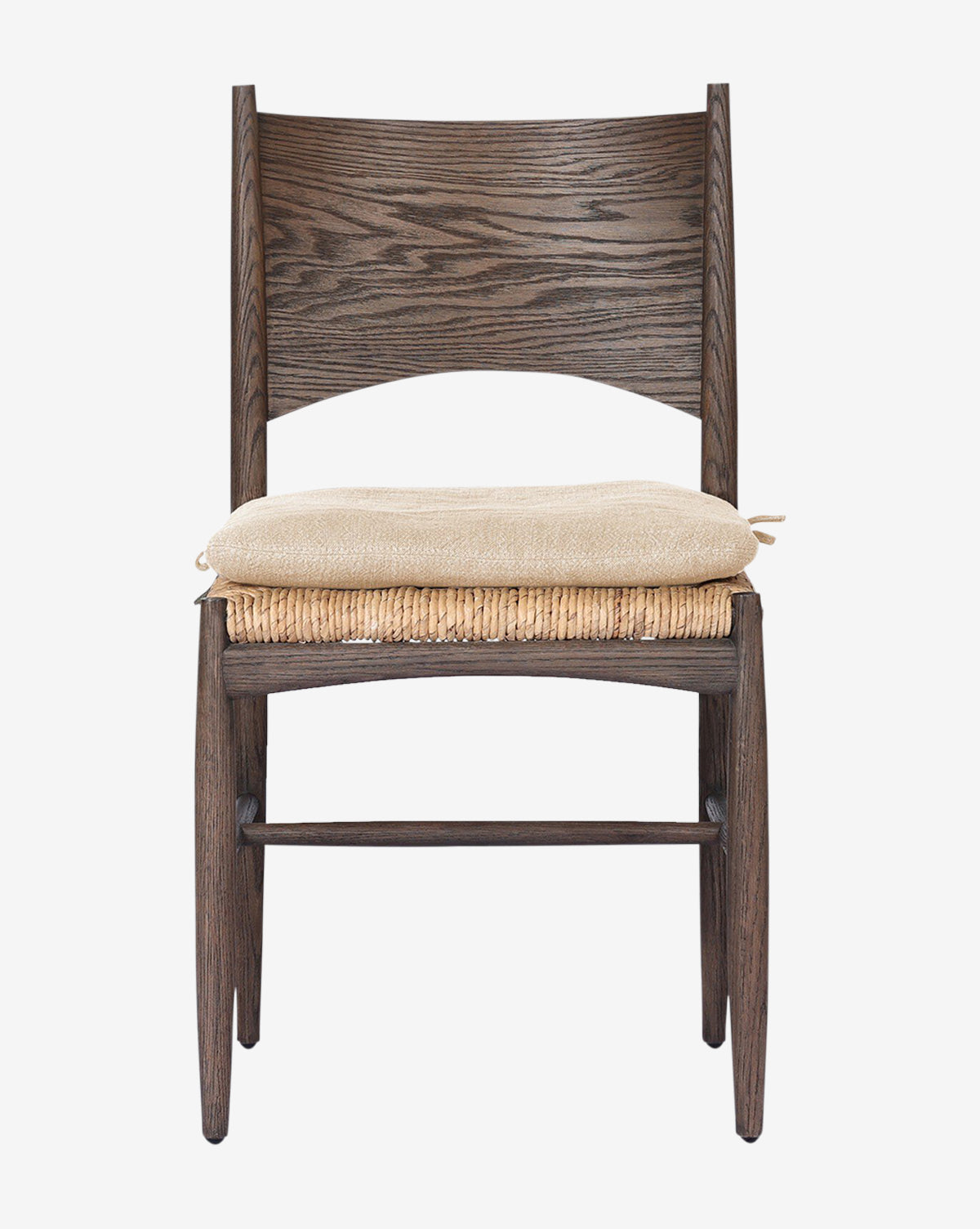 The Nixie Dining Chair features dark solid oak, a woven banana leaf seat, and a light high-performance fabric cushion, shown against a plain white background by McGee & Co.