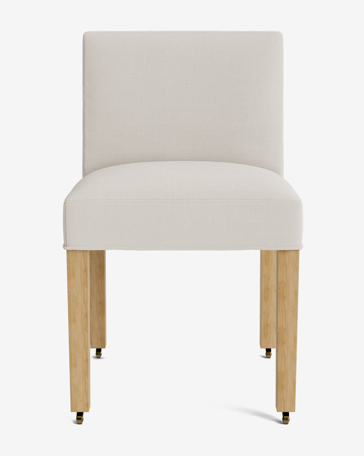 Front view of the Olivier Upholstered Dining Chair featuring a light beige high-quality fabric seat and backrest, plus four light wood legs with brass-colored casters, set against a white background, by McGee & Co.