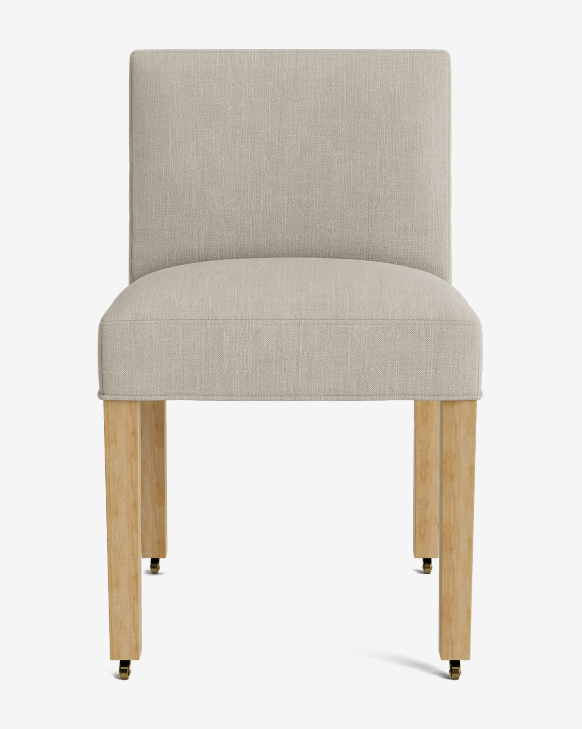 The Olivier Upholstered Dining Chair features a modern armless design, light beige high-quality fabric, wooden legs, and small black and gold casters, shown from the front against a white background by McGee & Co.